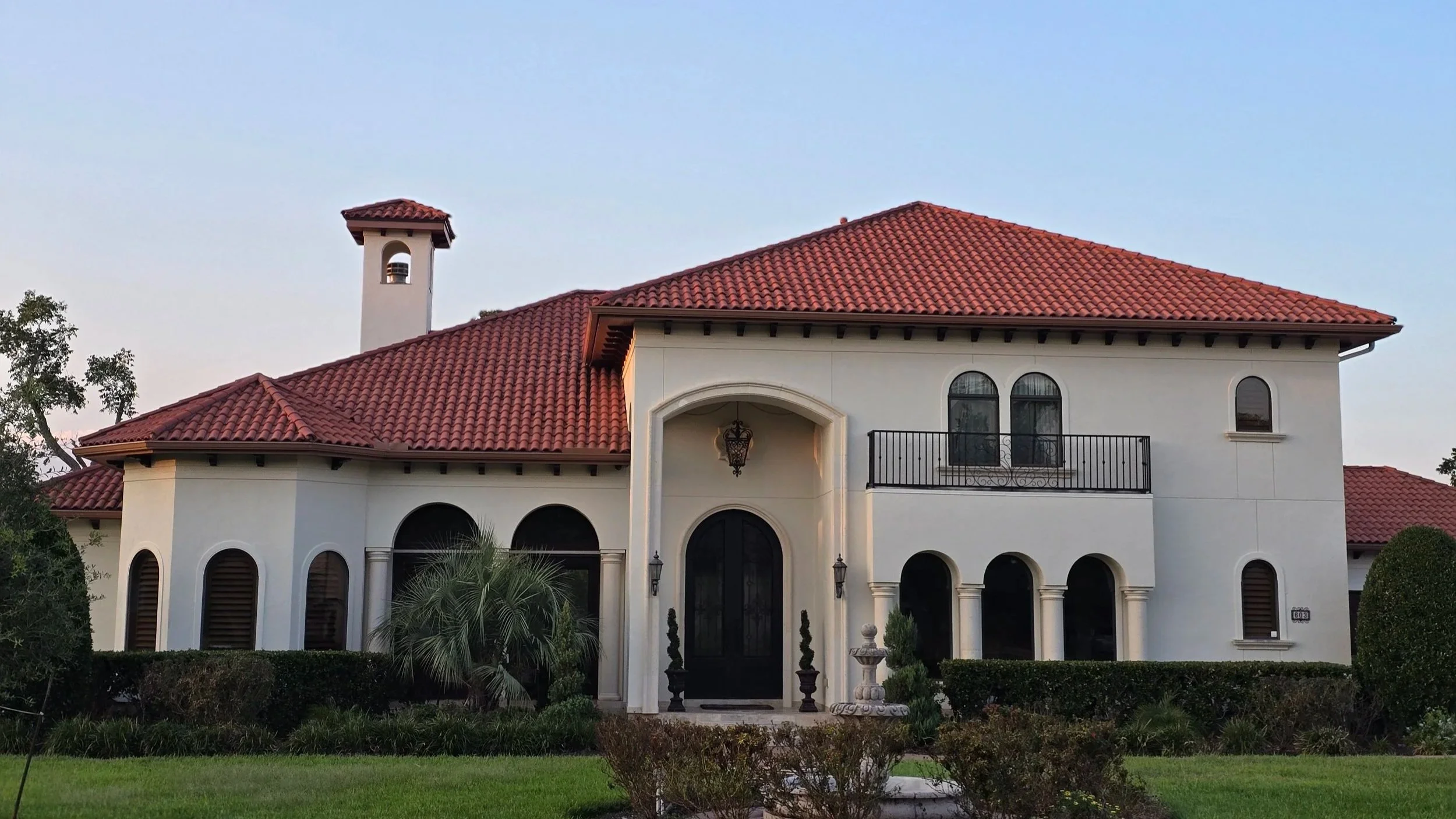 Mediterranean-style home exterior freshly painted in Richmond, TX by The Proud Paintbrush.