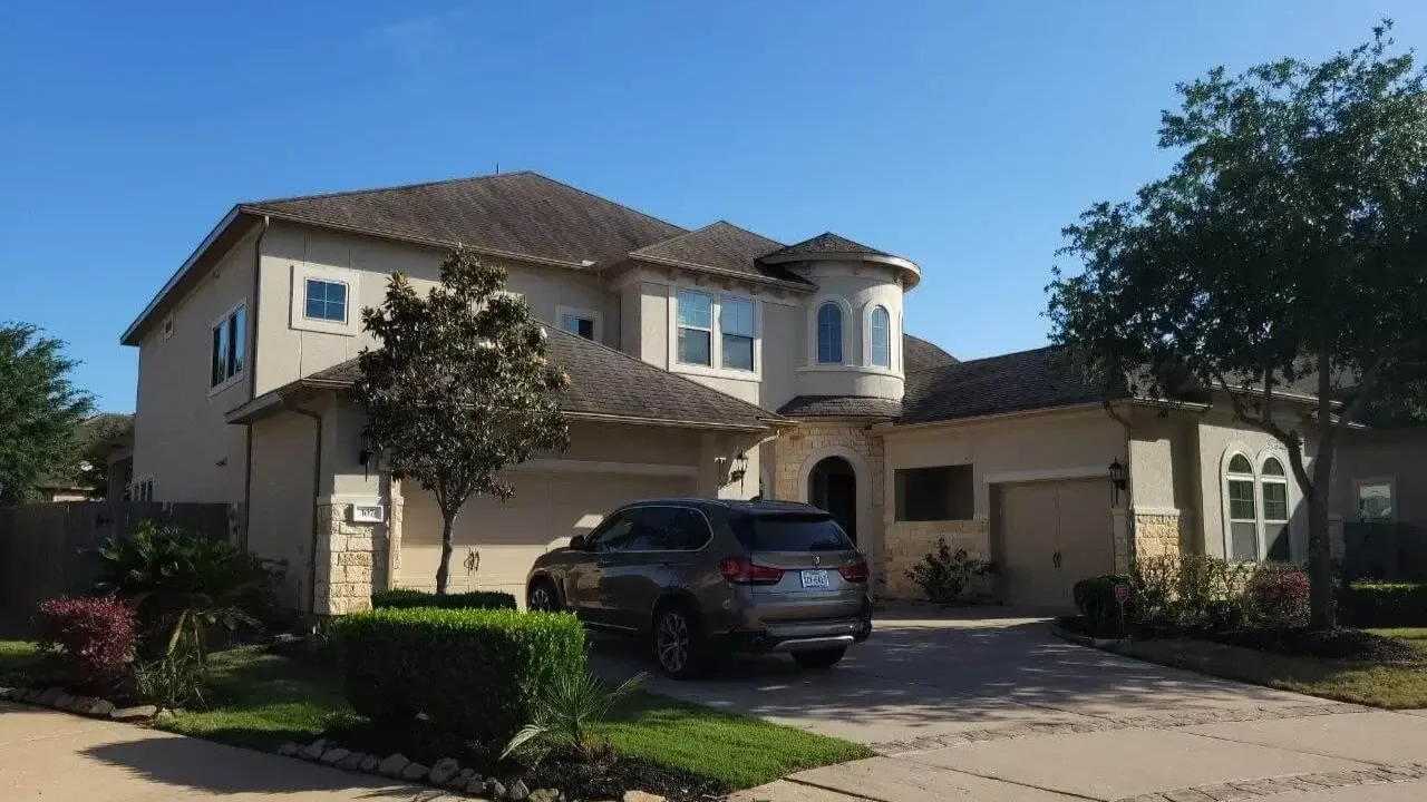 Exterior painting project on a stucco home in Richmond, TX by The Proud Paintbrush