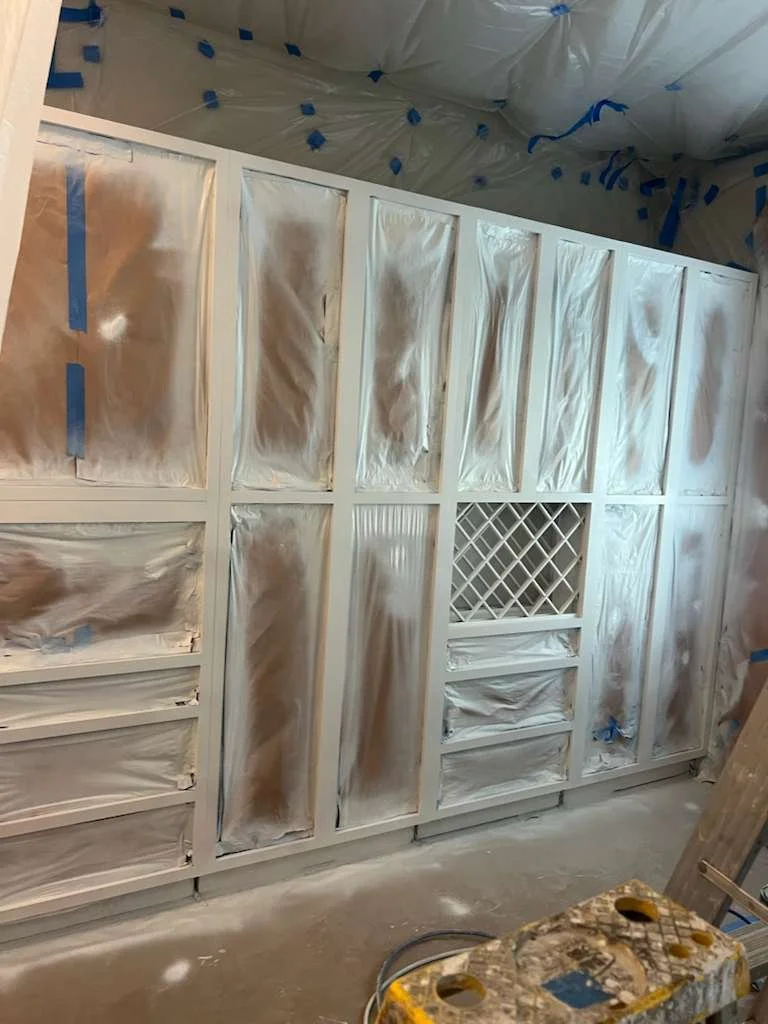 “Cabinet painting preparation with masking and protection in a Richmond home”