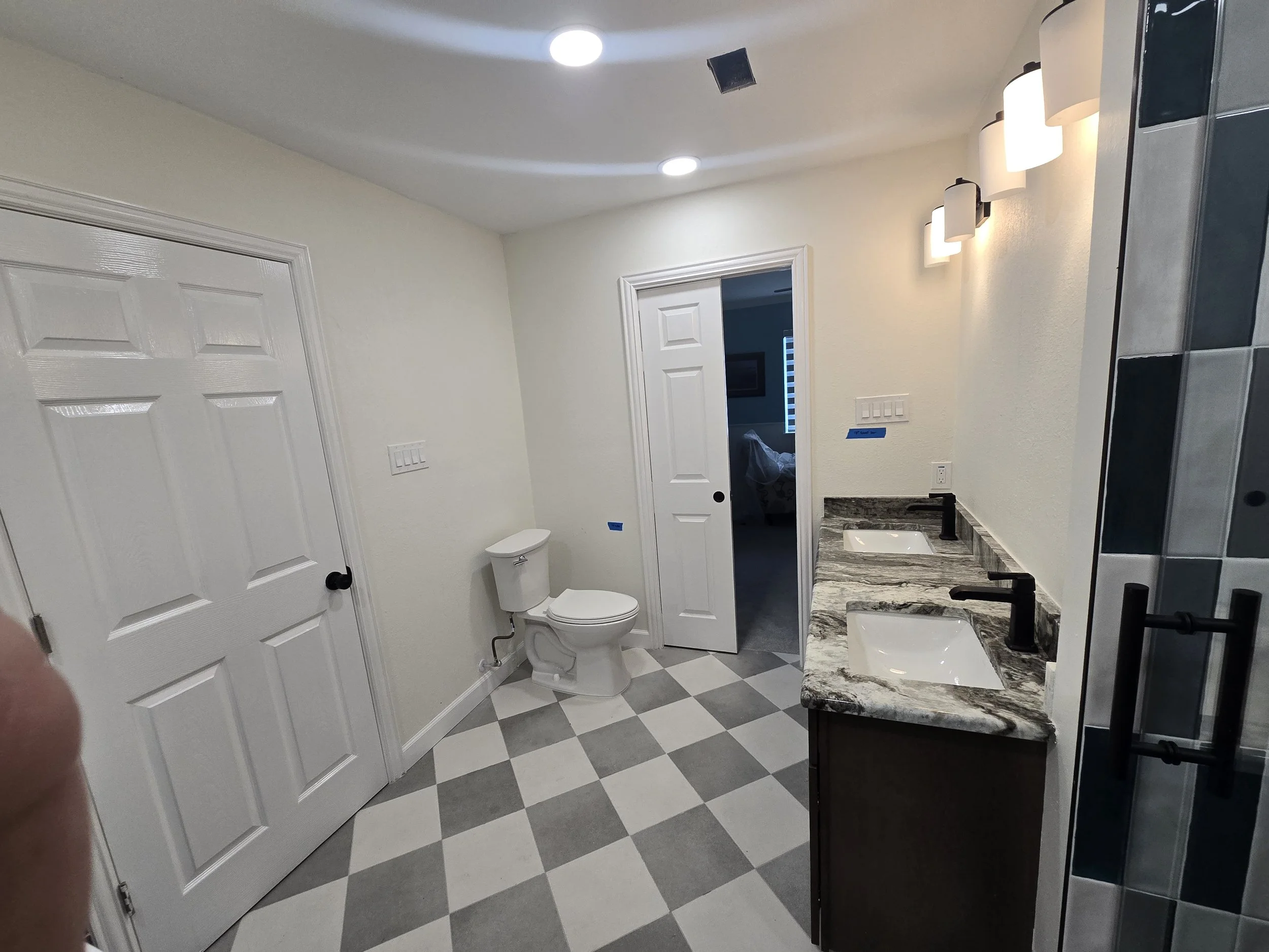 Freshly painted off-white bathroom interior in West Houston, TX with clean walls and updated finish