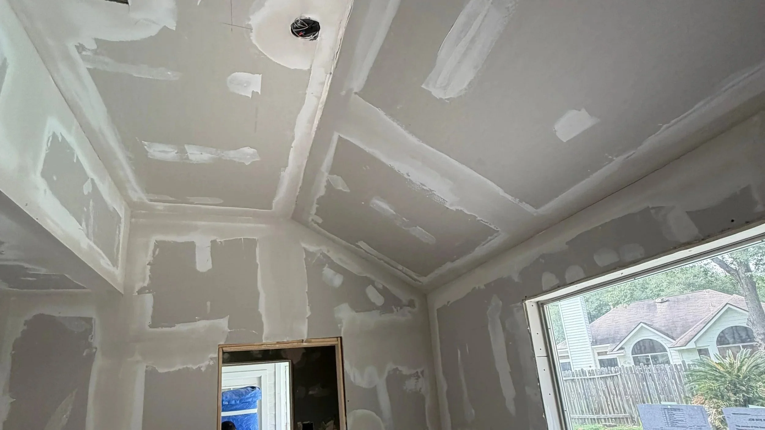Drywall repair and smooth texture finishing project in Sugar Land, TX by The Proud Paintbrush.
