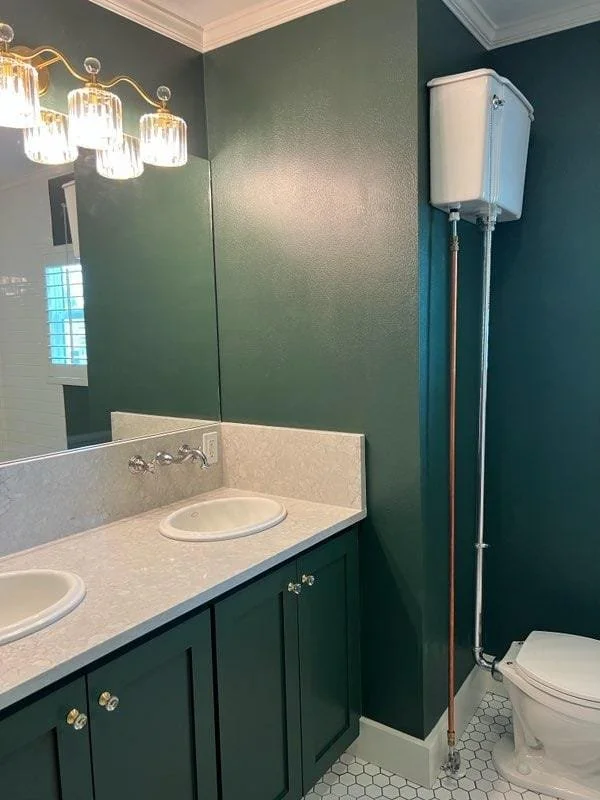 Freshly painted bathroom vanity with a smooth professional finish in West Houston, Texas