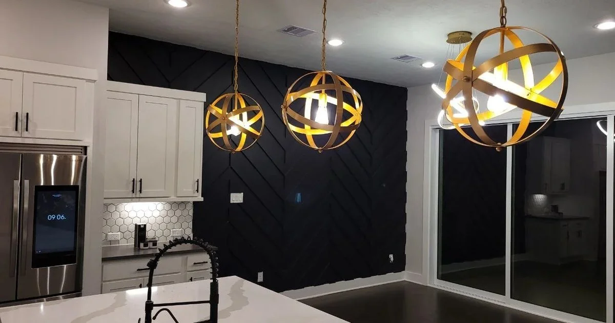 Freshly painted kitchen with a bold black feature wall in a Katy, Texas home