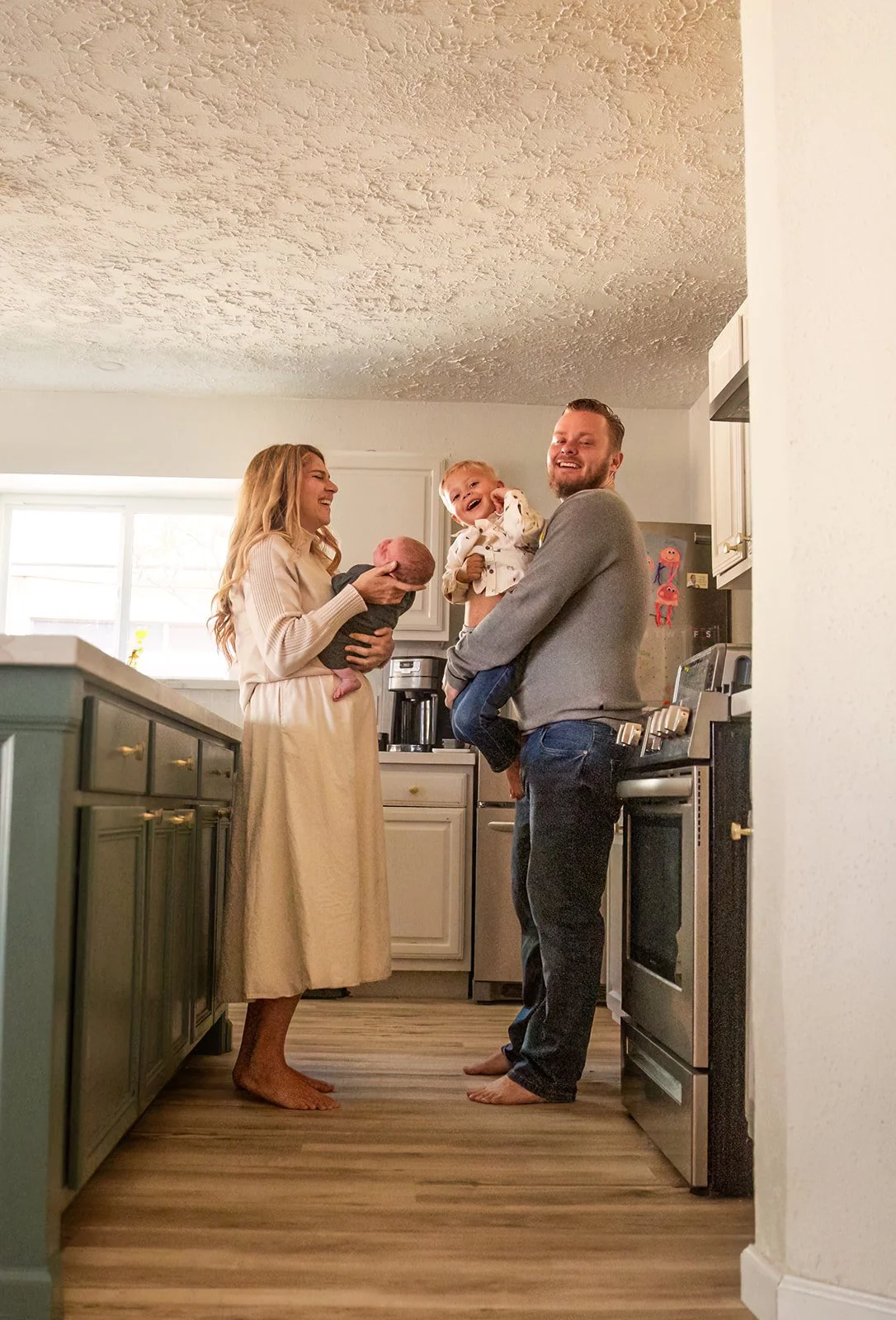 Chris Petkau, owner of The Proud Paintbrush painting company, with his wife and two children.