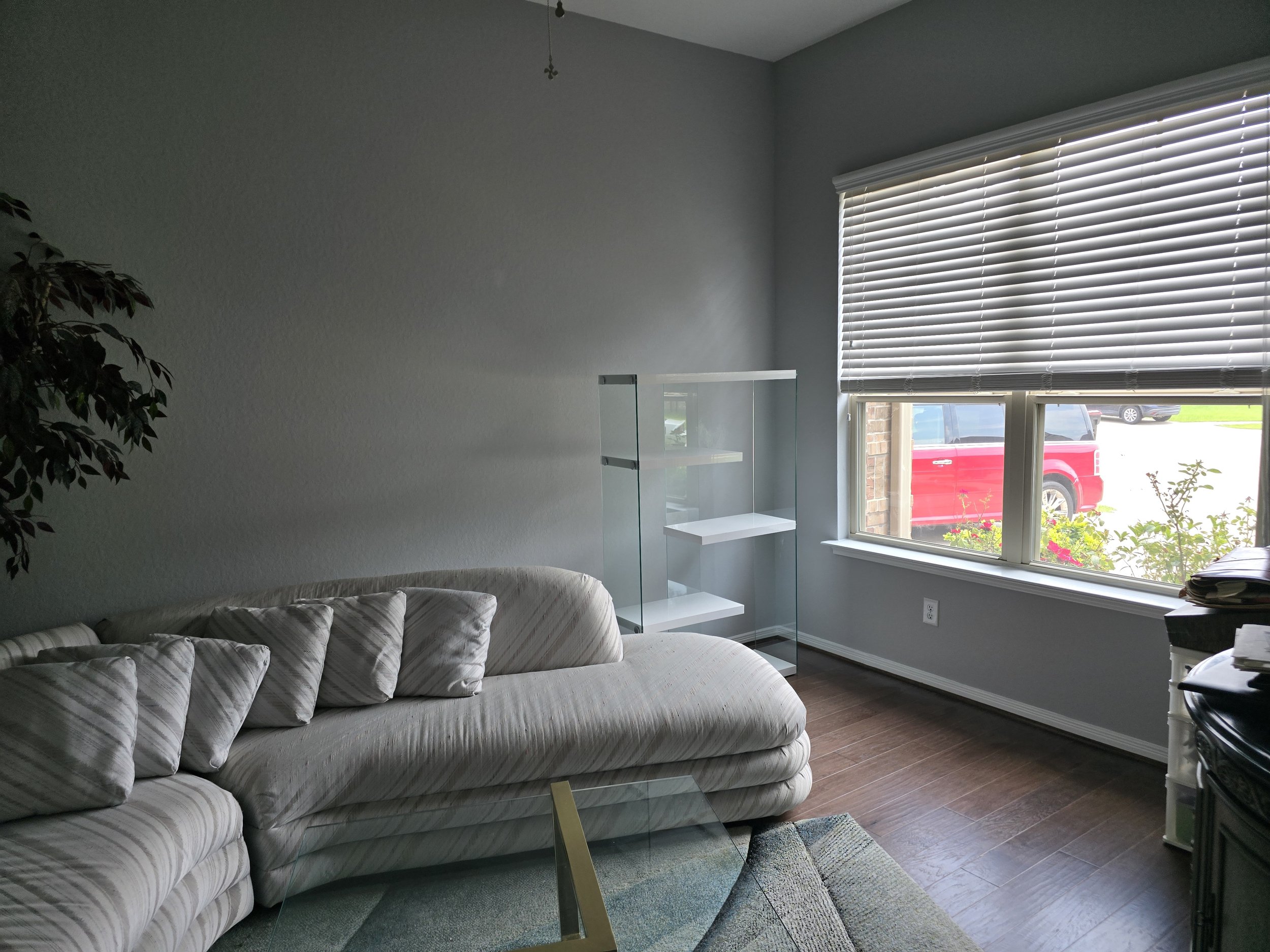 Freshly painted sitting room with dark gray walls in Fulshear, Texas