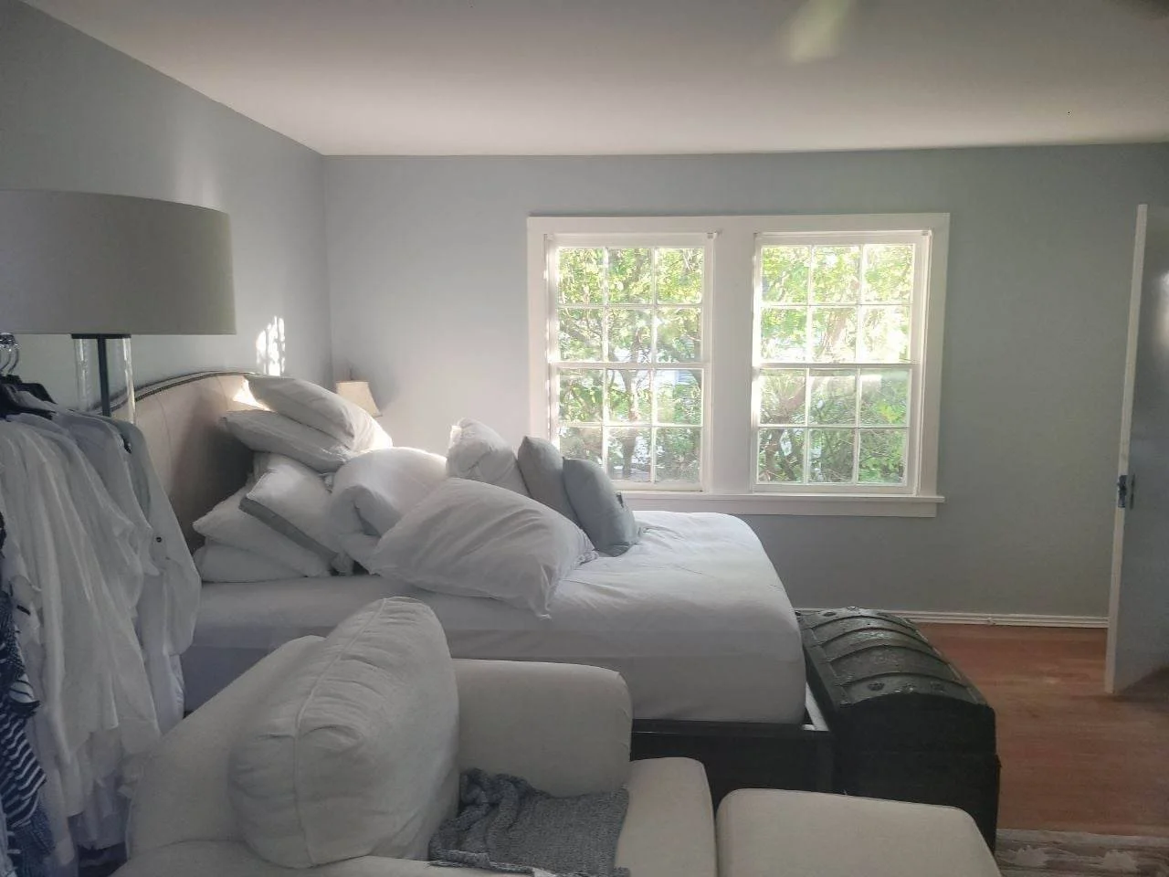 Freshly painted light blue bedroom interior with natural light in West Houston, Texas.
