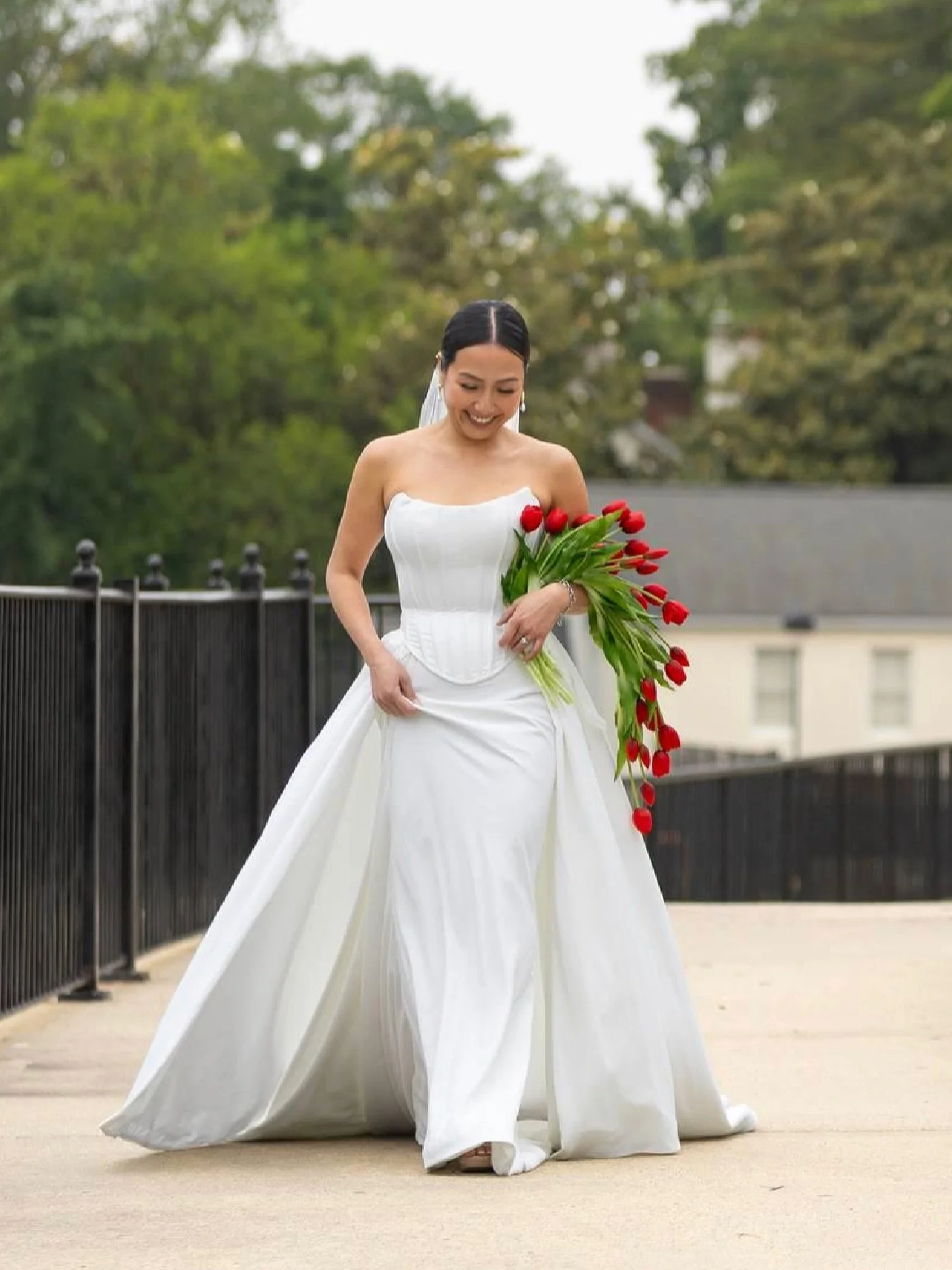 The beautiful bride, Kristy, with our cascading bouquet design in bold red &hearts;️

&ldquo;Absolutely gorgeous bouquet! I&rsquo;m so happy I chose this for my wedding. Best part is that it lasts forever and can be displayed as a way to remember our