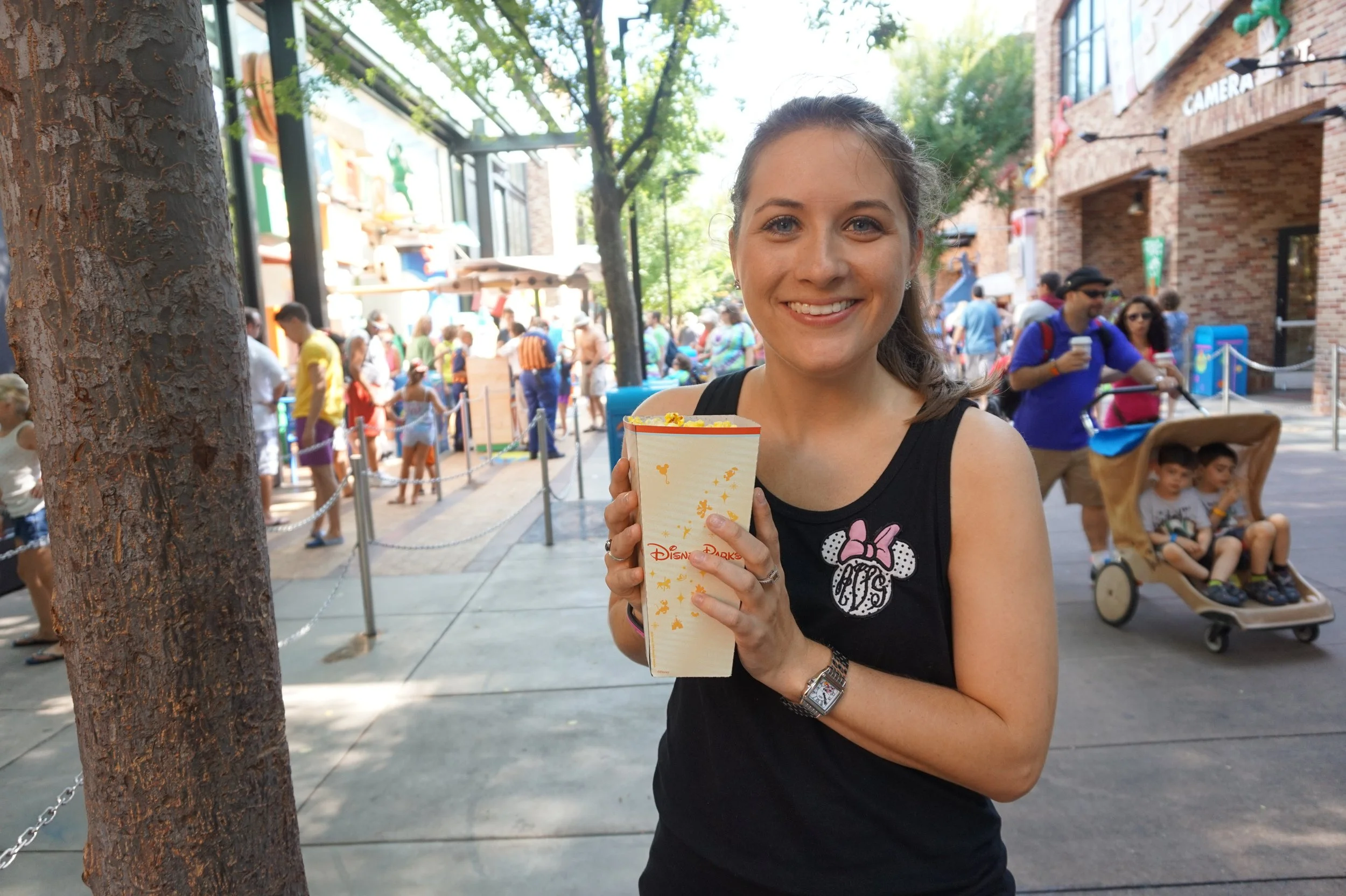 The author's sister holds a box of popcorn in Hollywood Studios at Disney World