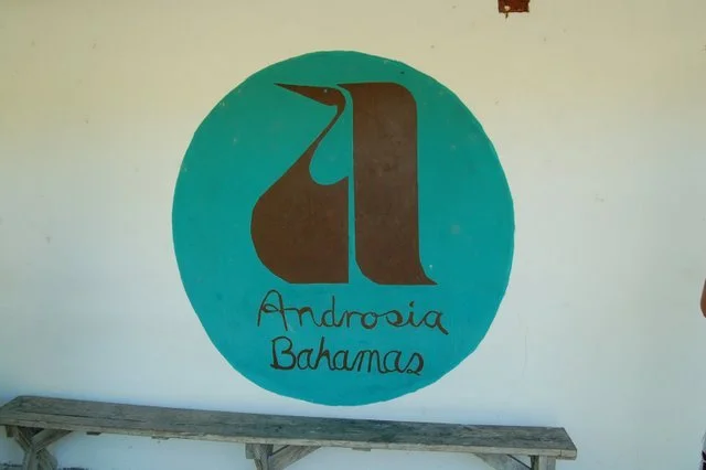 Painted sign on the side of the Androsia Fabric Factory building