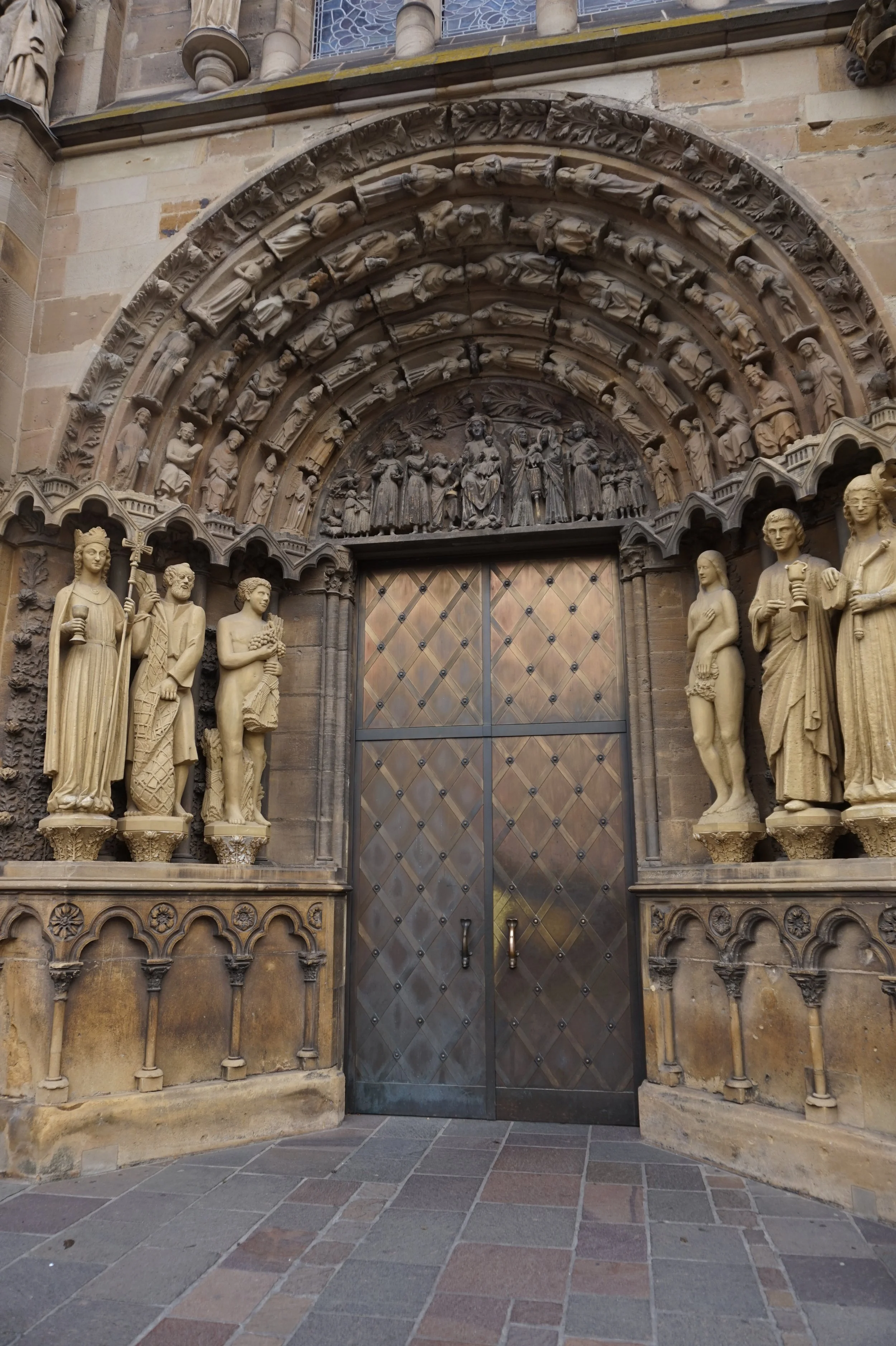 Intricately carved entrance door and exterior of the Church of Our Lady