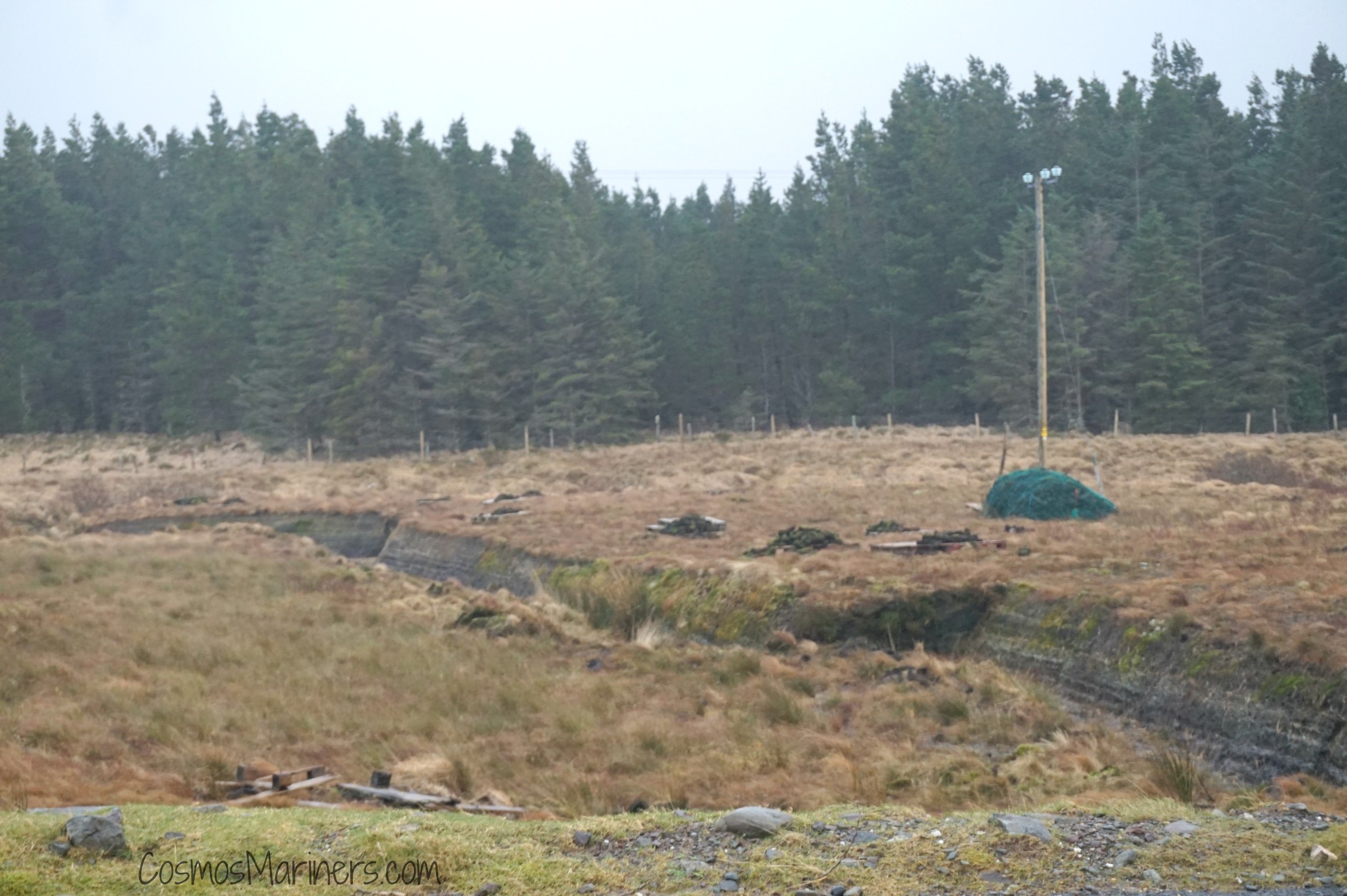 A field in Ireland where a line of peat has been exposed by farmers
