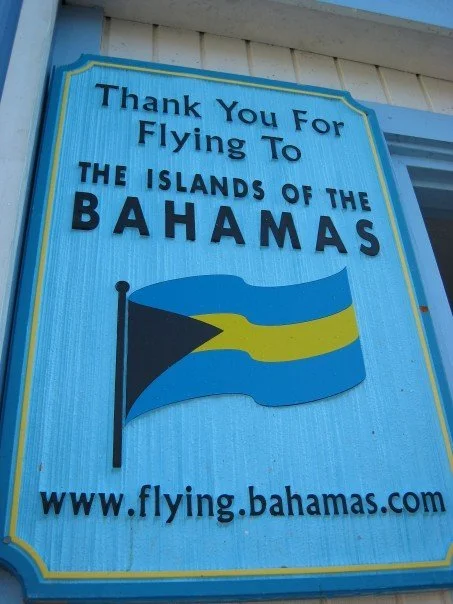 Wooden sign at the Andros Island airport