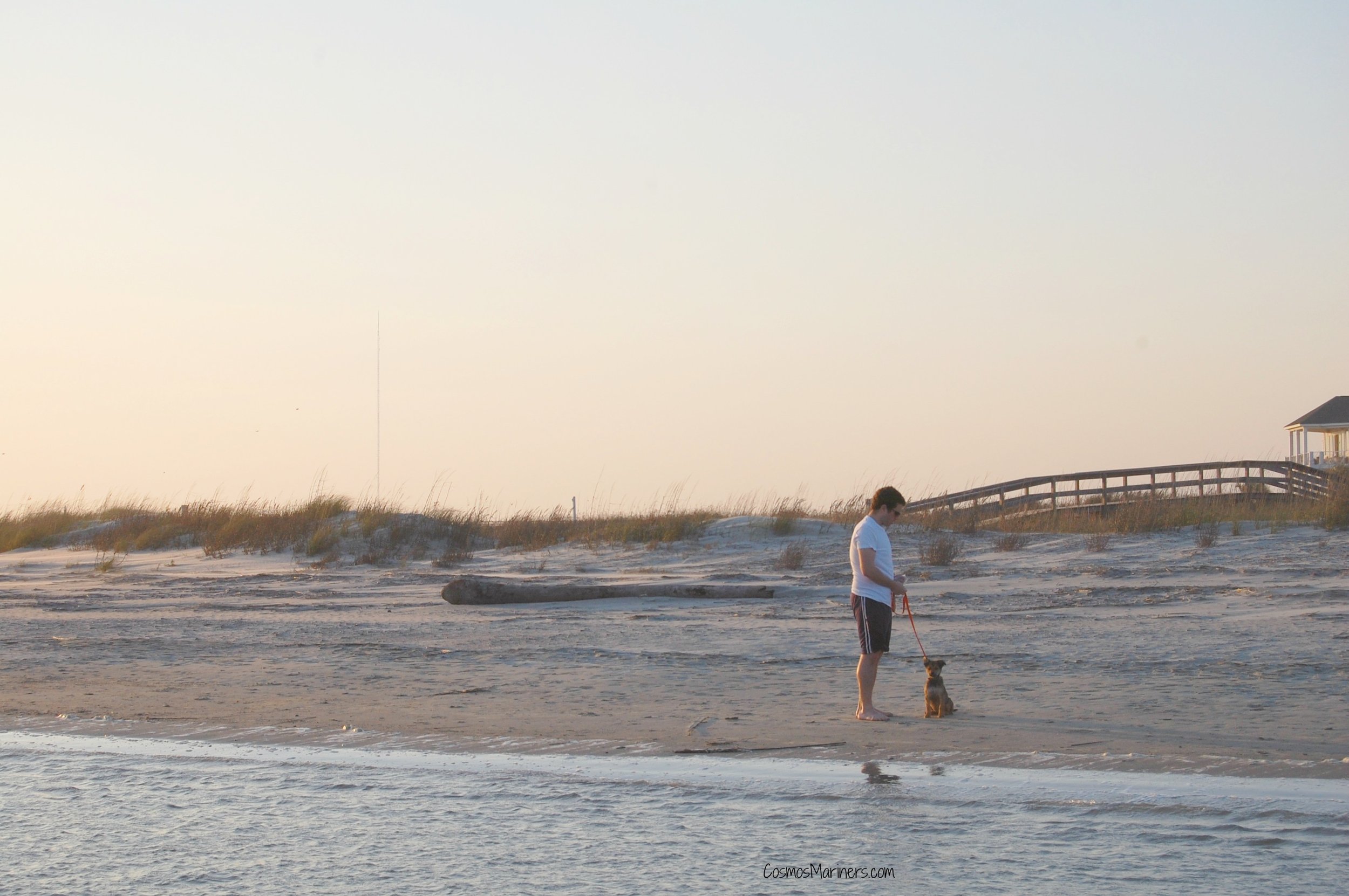 man with dog on Isle of Palms, South Carolina
