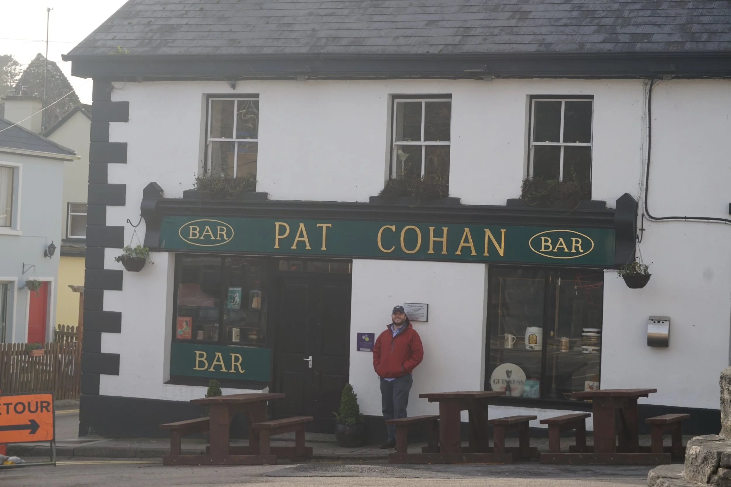 The author's husband in front of a filming location for The Quiet Man in Cong, Ireland