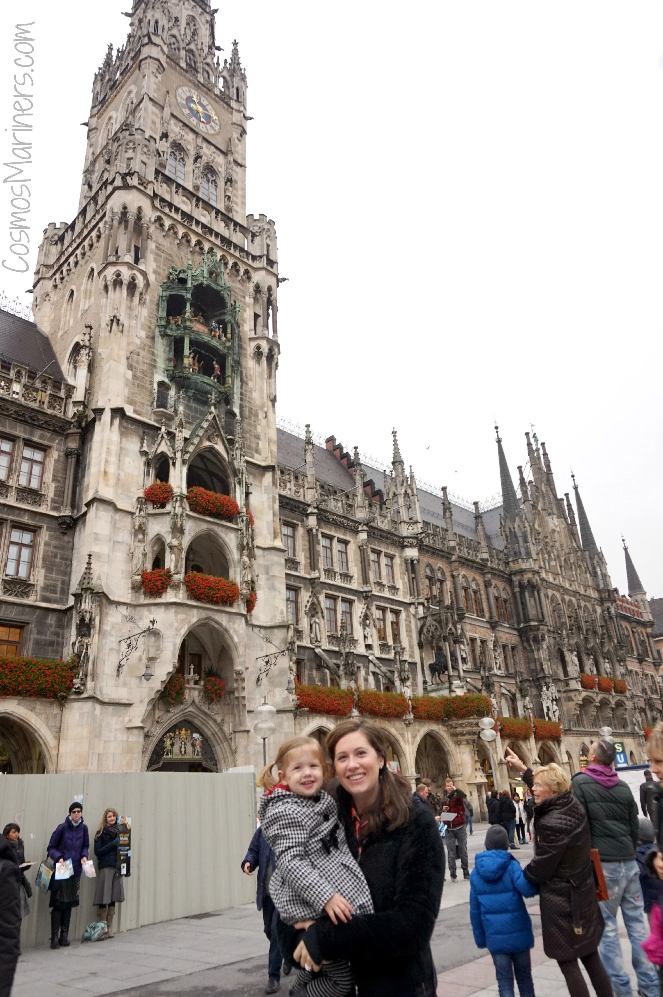 The author holder her toddler in front of the Rathaus in Munich's Marienplatz