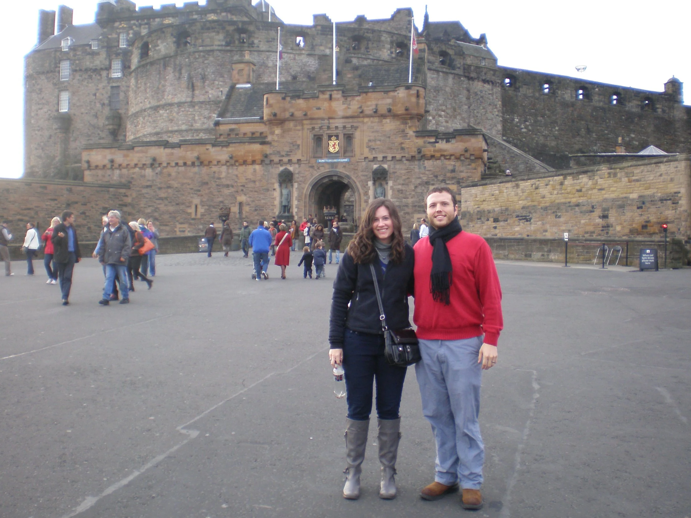 The author and her husband stand outside of the entrance to Edinburgh Castle