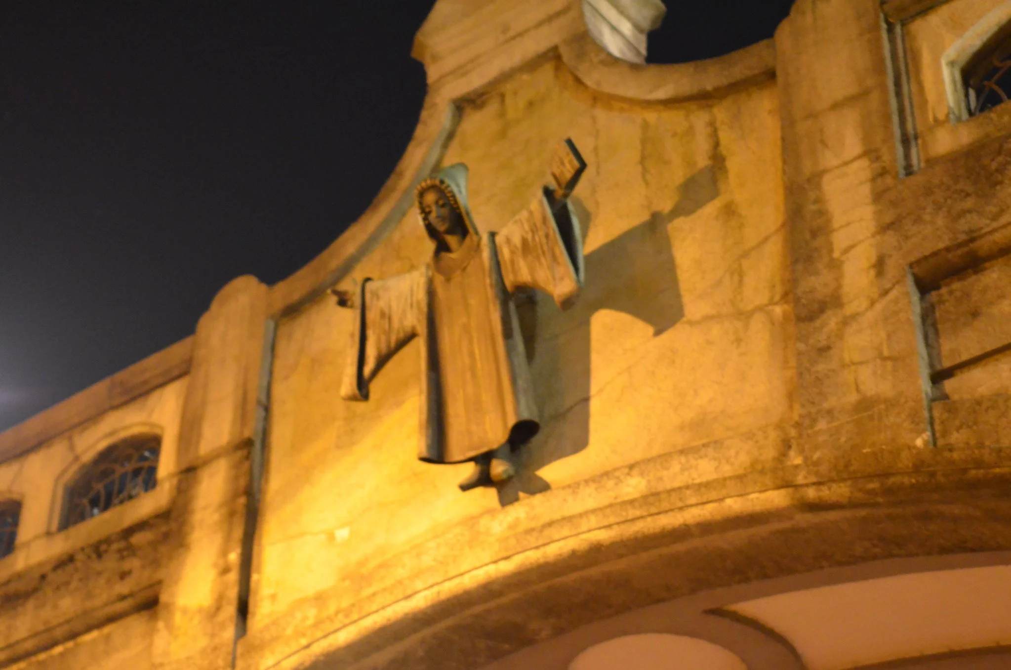 Carved stone Münchner Kindl on a bridge in Munich