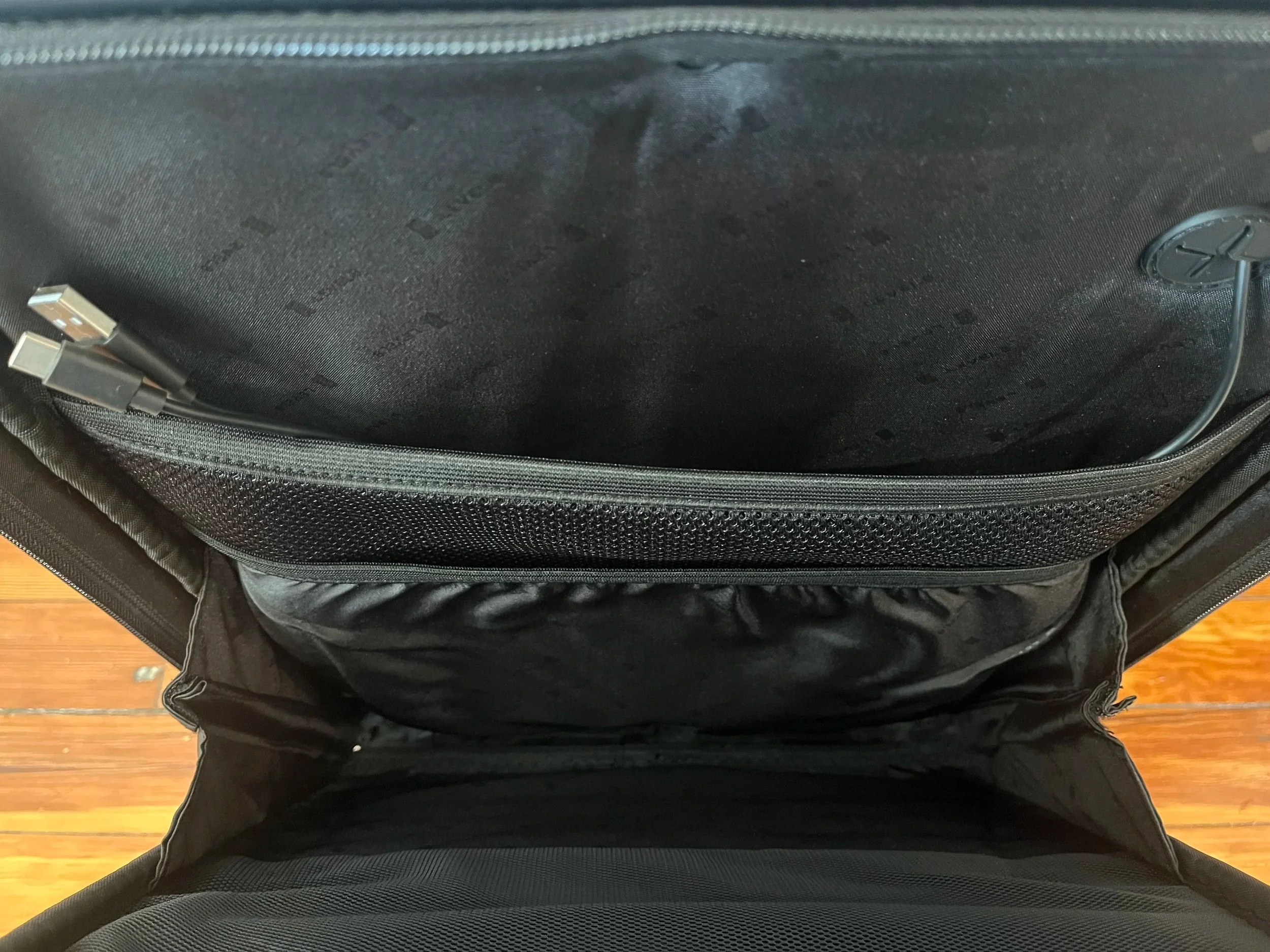 Pockets inside the suitcase's front compartment with USB cords