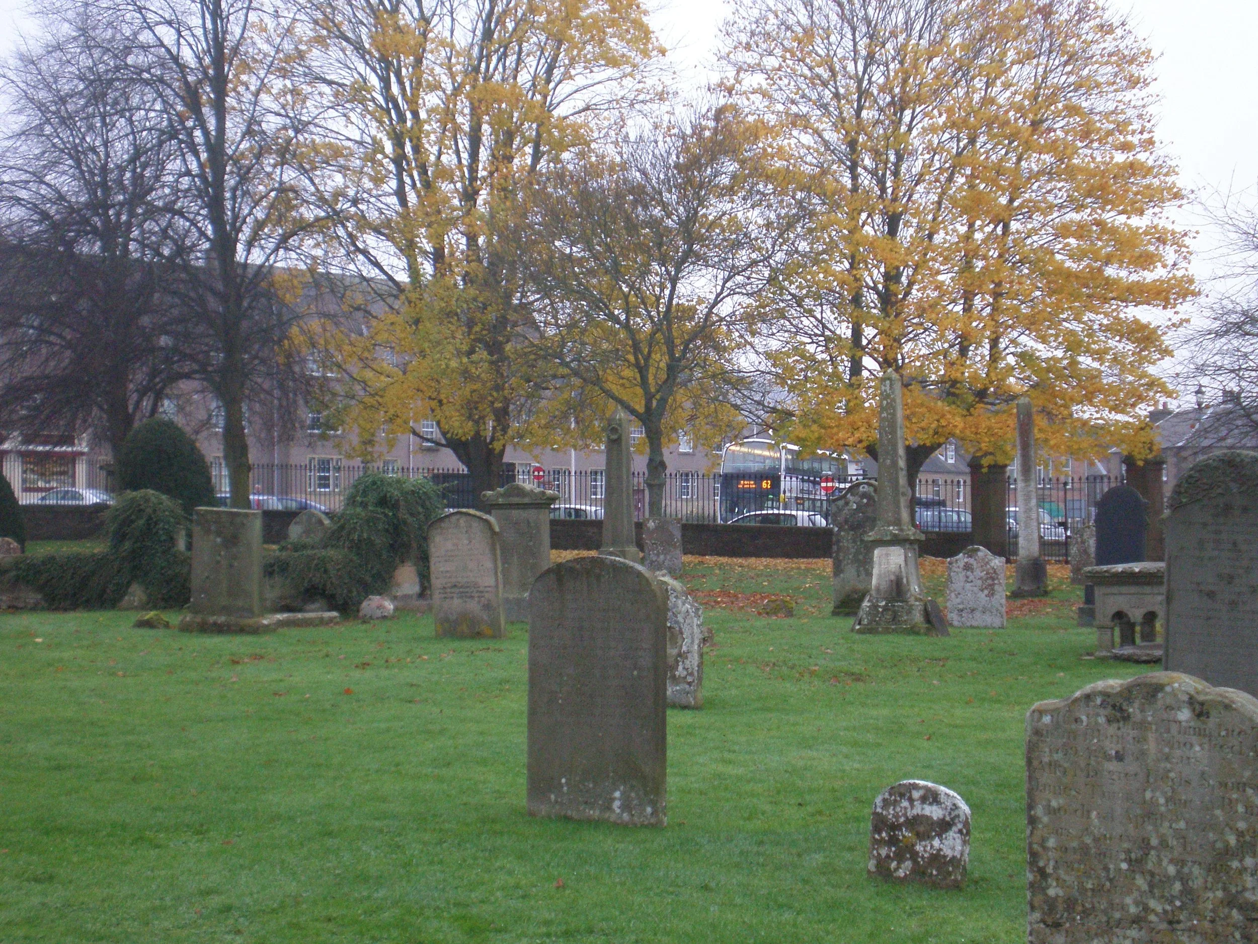 The Melrose Abbey cemetery with the property's fence in the background