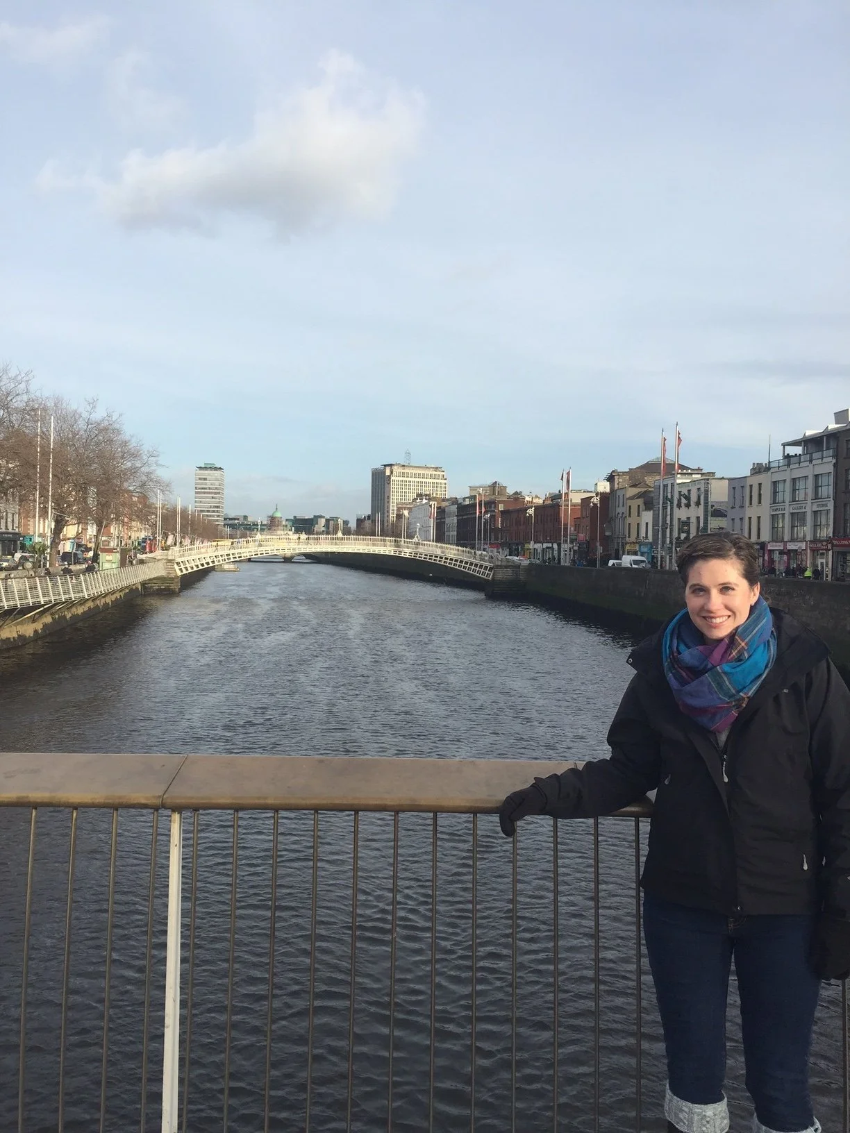 The author in a black coat standing on Ha'Penny Bridge