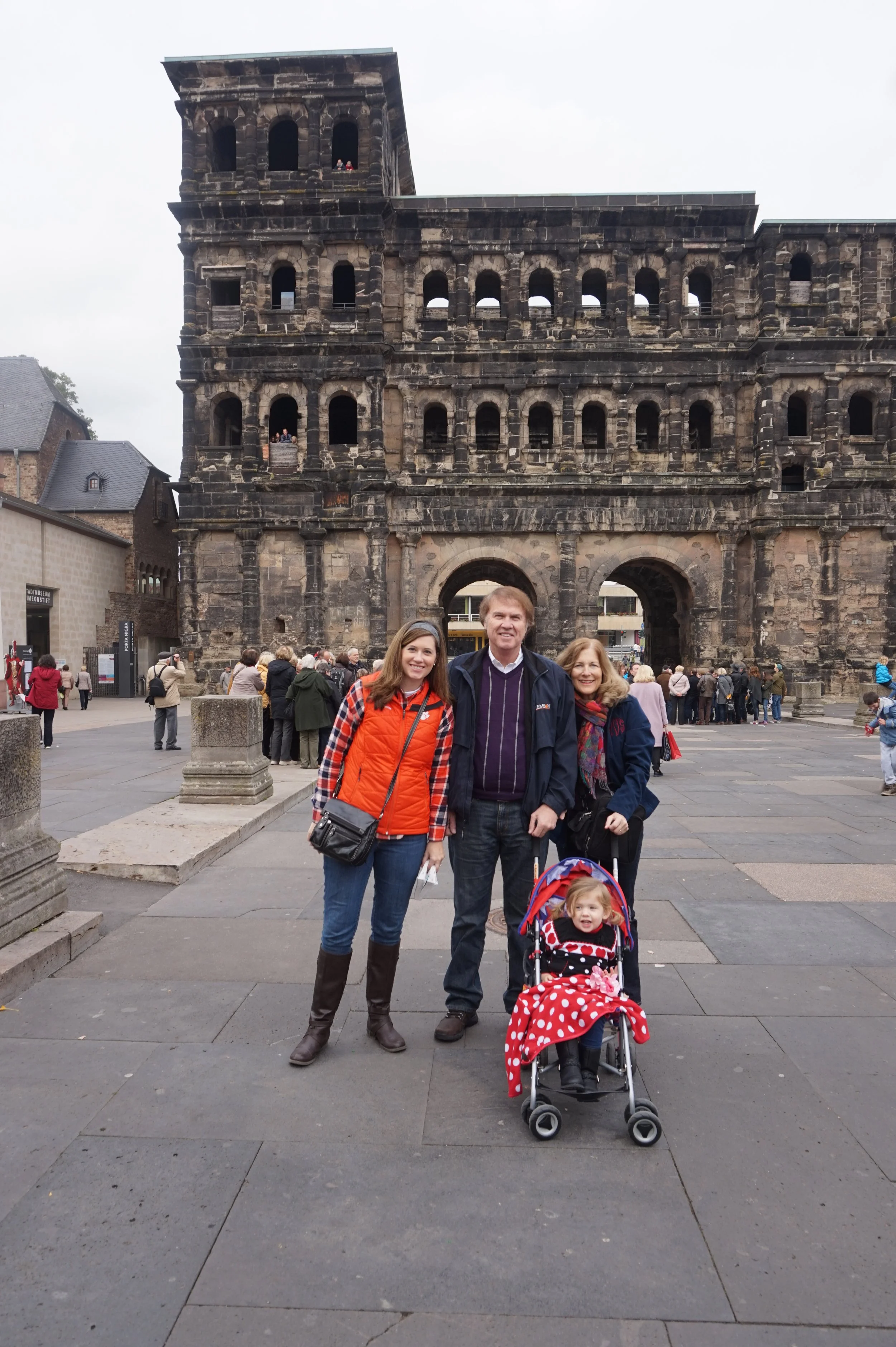 The author's family standing in front of the Porta Nigra in Trier, Germany