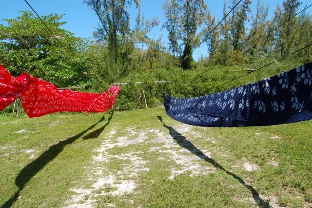 Rows of dyed fabric hanging to dry at the Androsia Fabric Factory in Bahamas