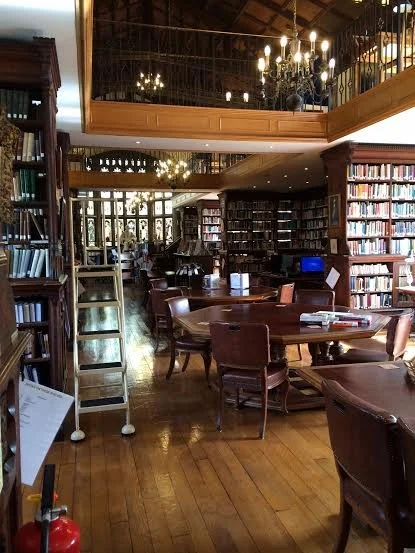 Chairs and tables inside the Harris Manchester Library at Oxford University