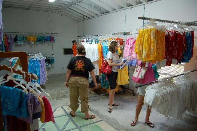 Three women shopping at the Androsia factory store