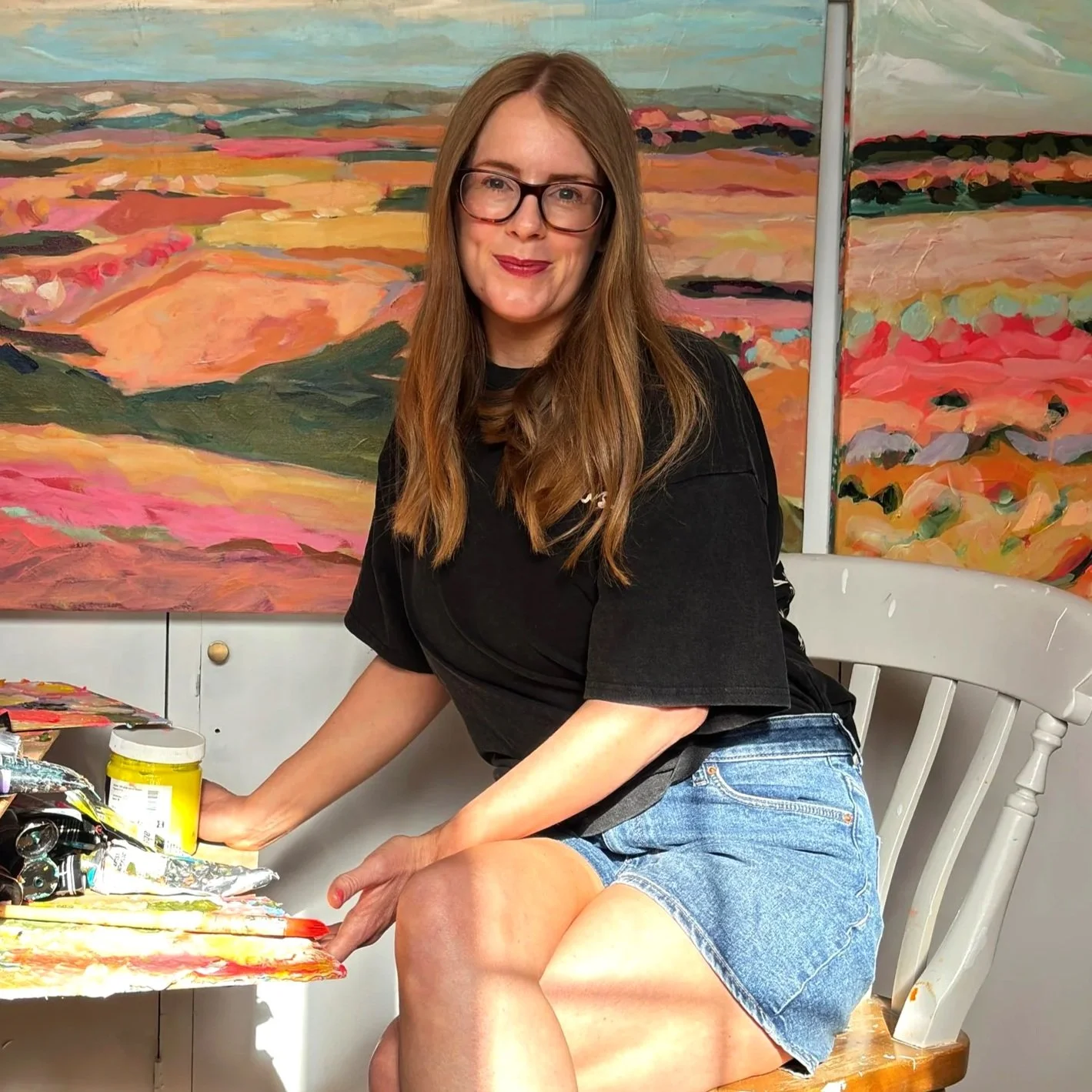 British artist Amy Rhodes in her South Staffordshire studio with her vibrant abstract landscapes.