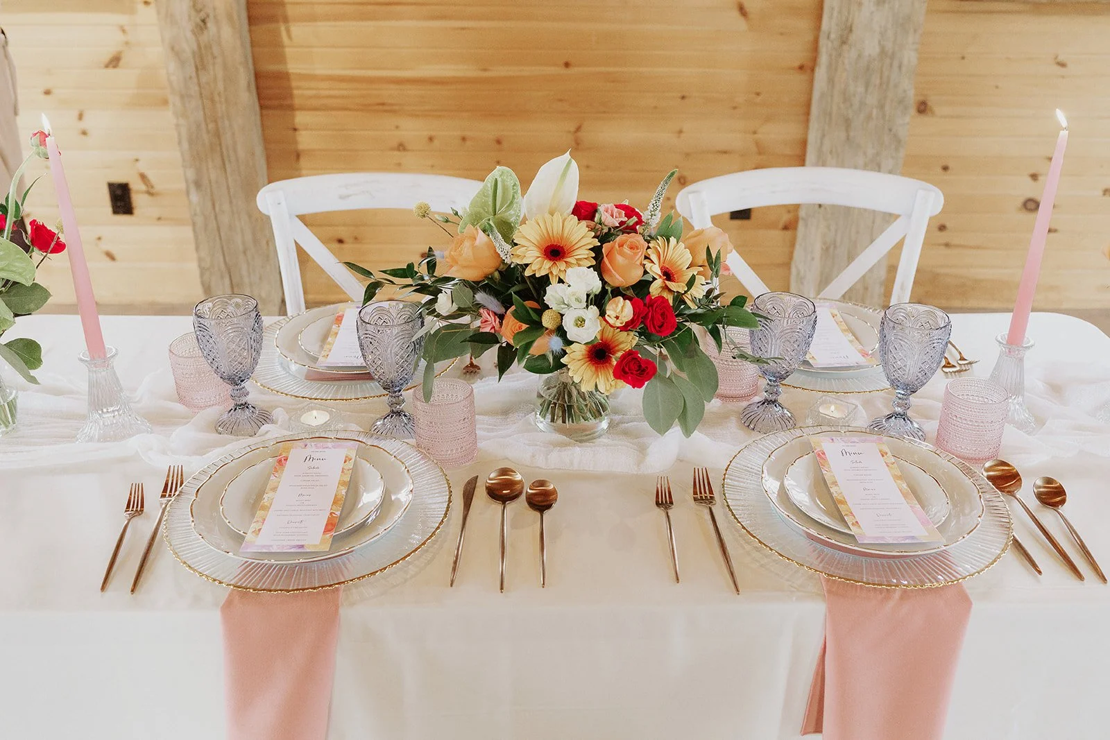 Menu cards at place settings with flowers