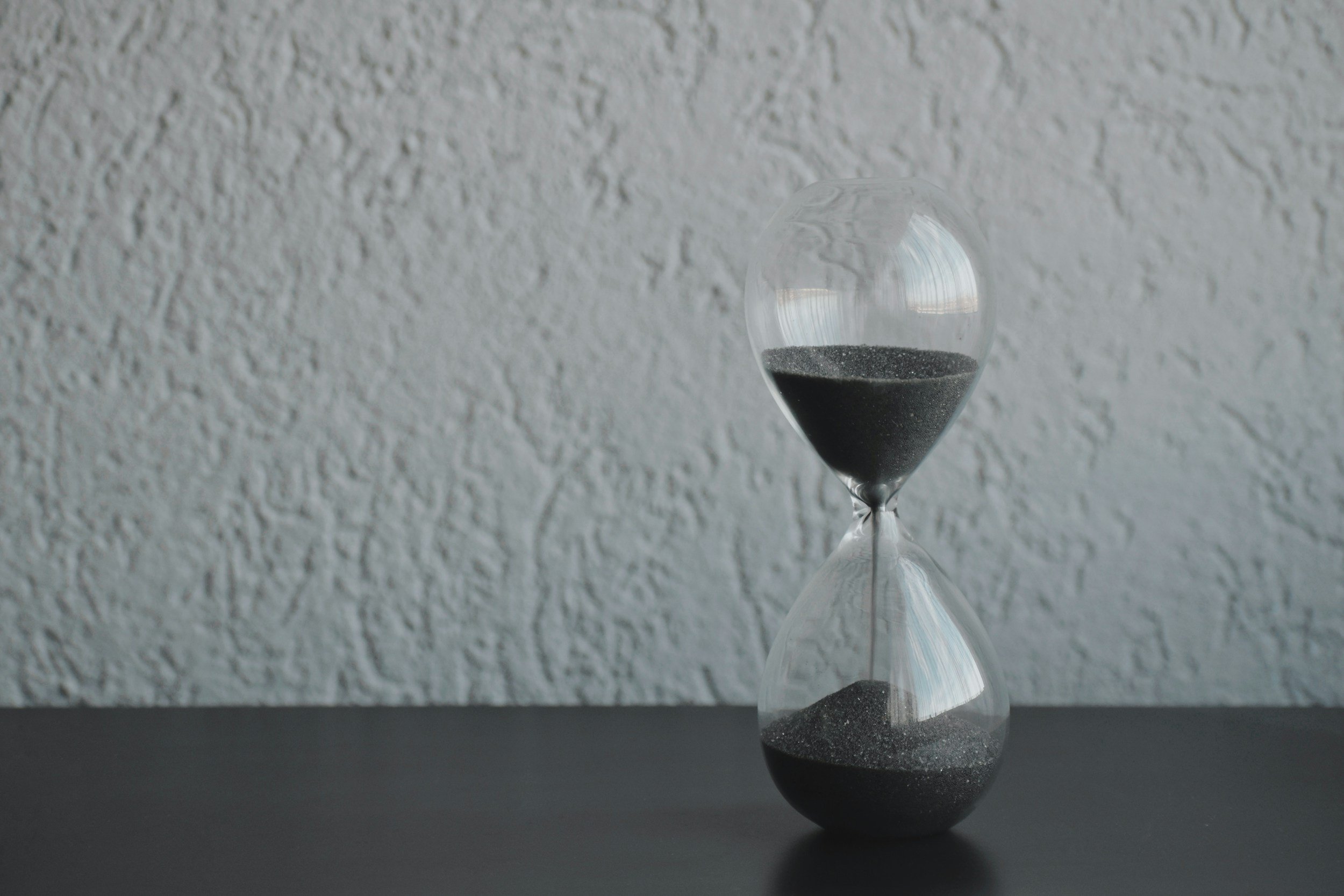 Hourglass symbolizing that effective time management starts with clarity, priorities, and intentional choices.