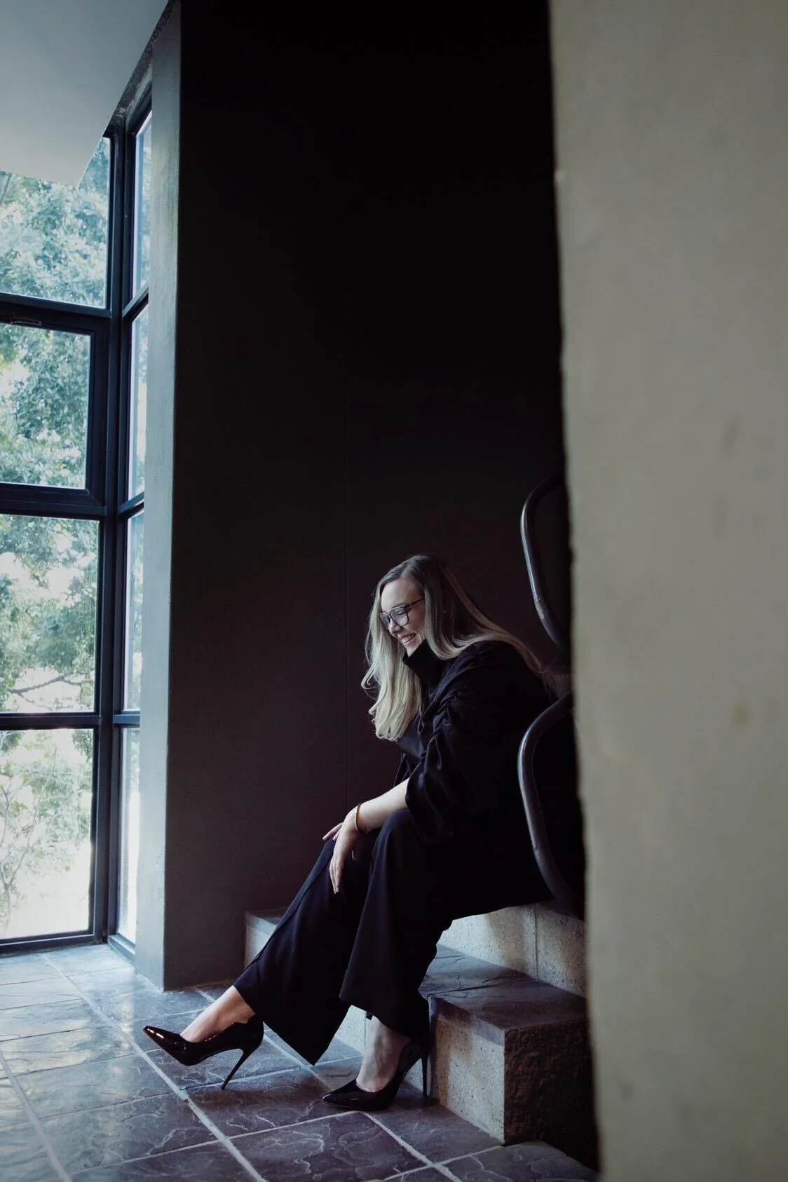 woman sitting on the stairwell