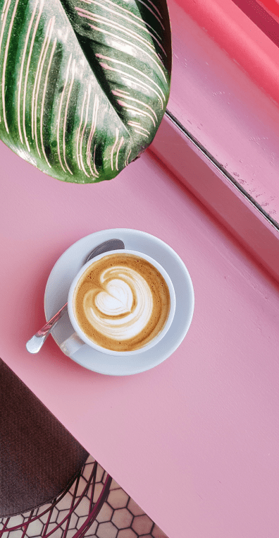cappucino sitting on a pink table