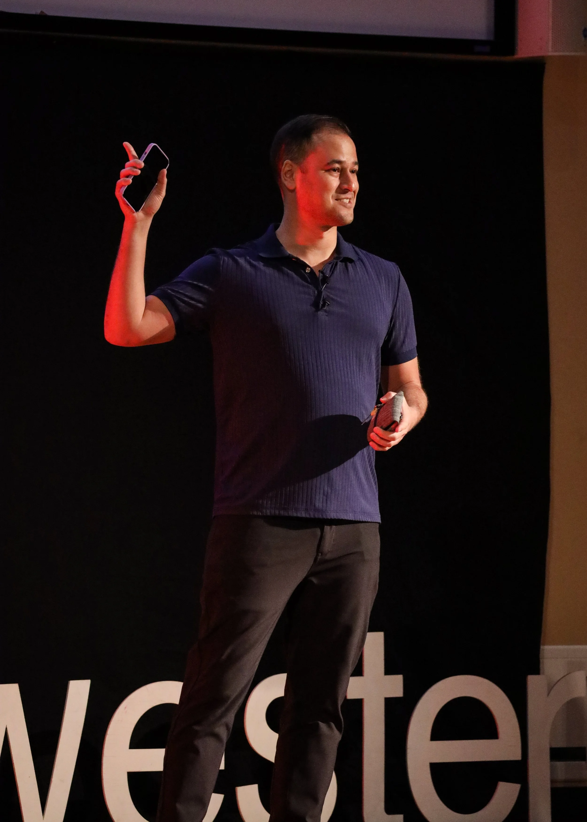 Adam Joel speaking on TEDx stage