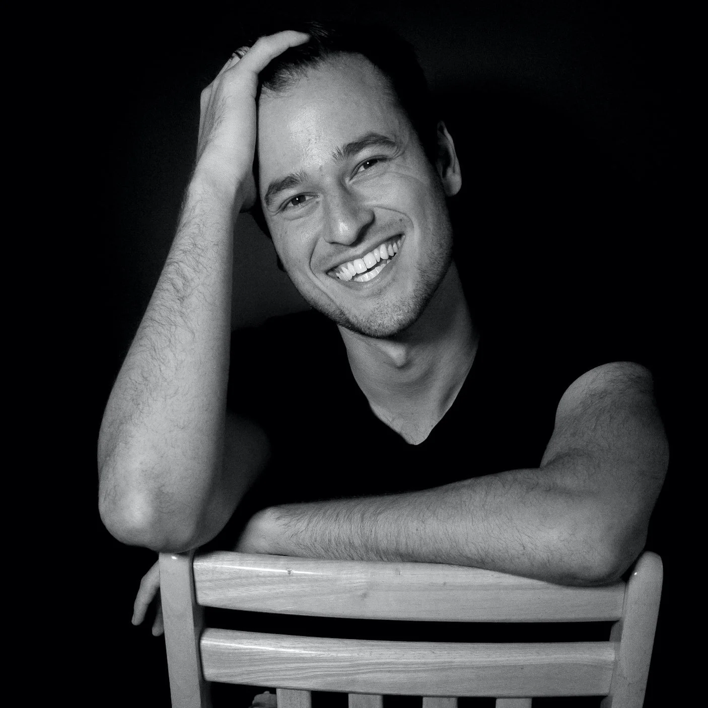 Adam Joel sitting in a chair