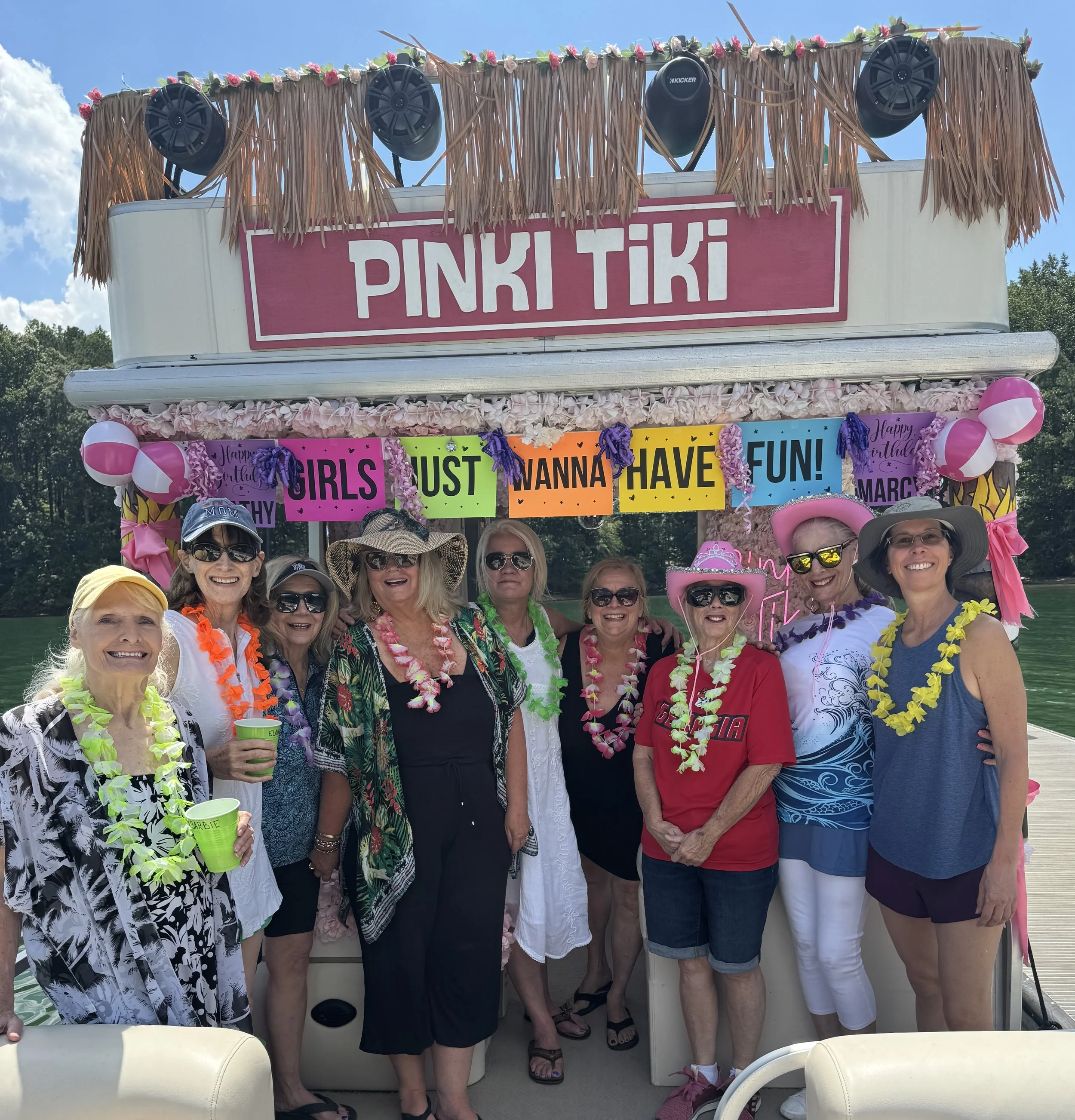Party on pink tiki boat.