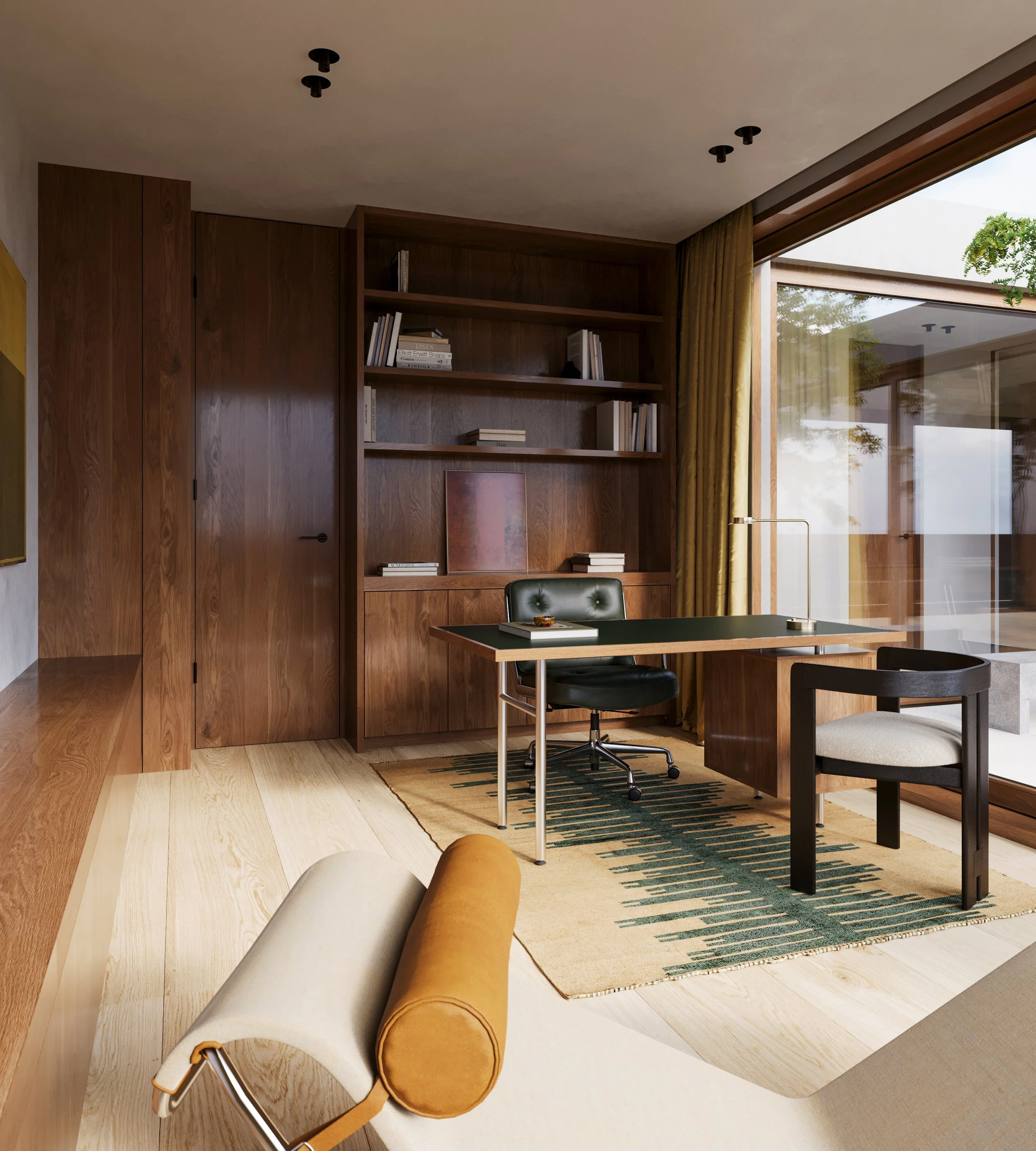 A modern home office with wooden built-in shelves, a glass door to the outside, a desk with a black chair, a small table, a floor lamp, and a yellow and beige rug.