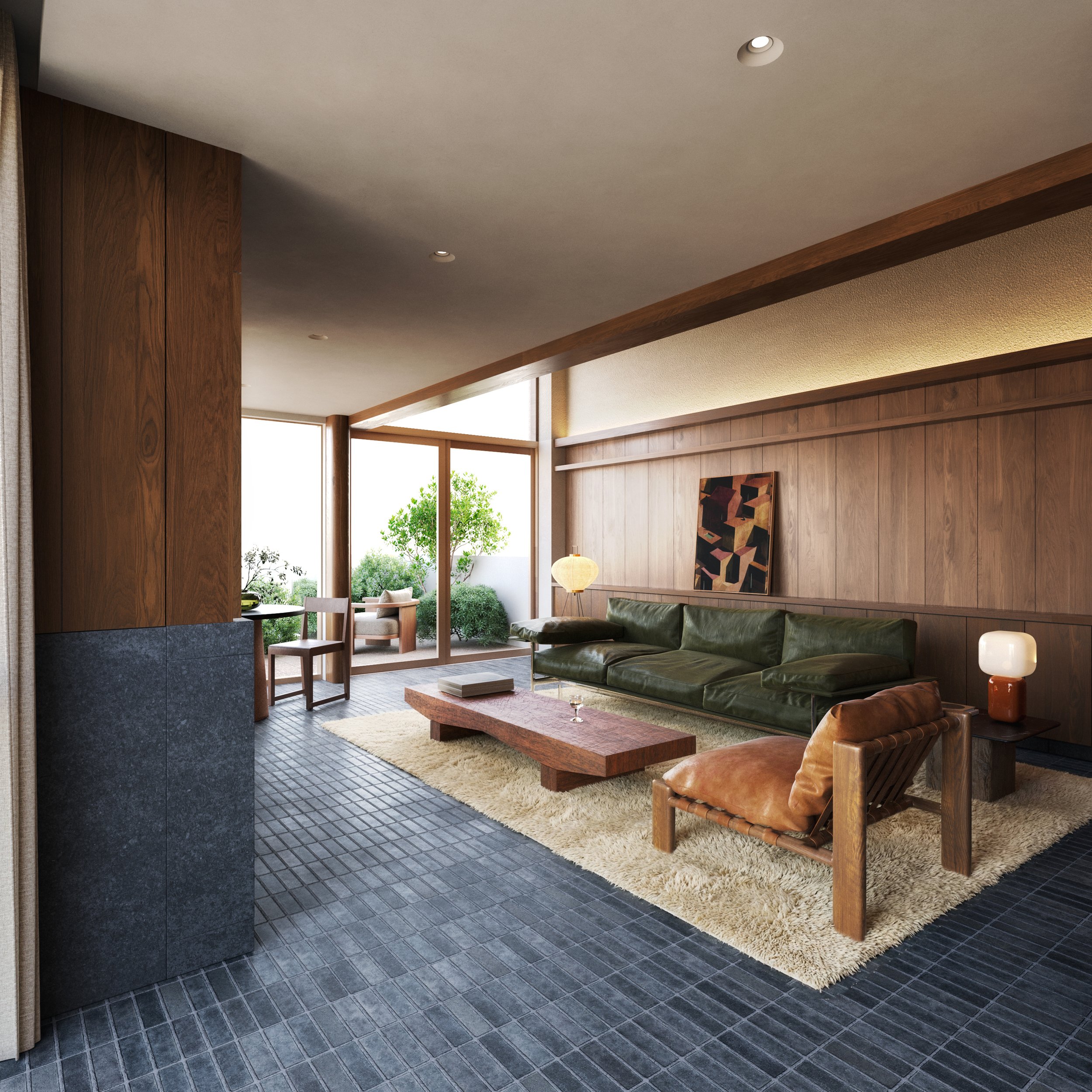Living room with a green sofa, leather armchair, wooden coffee table, beige rug, wood-paneled walls, and large windows with outdoor seating and greenery.
