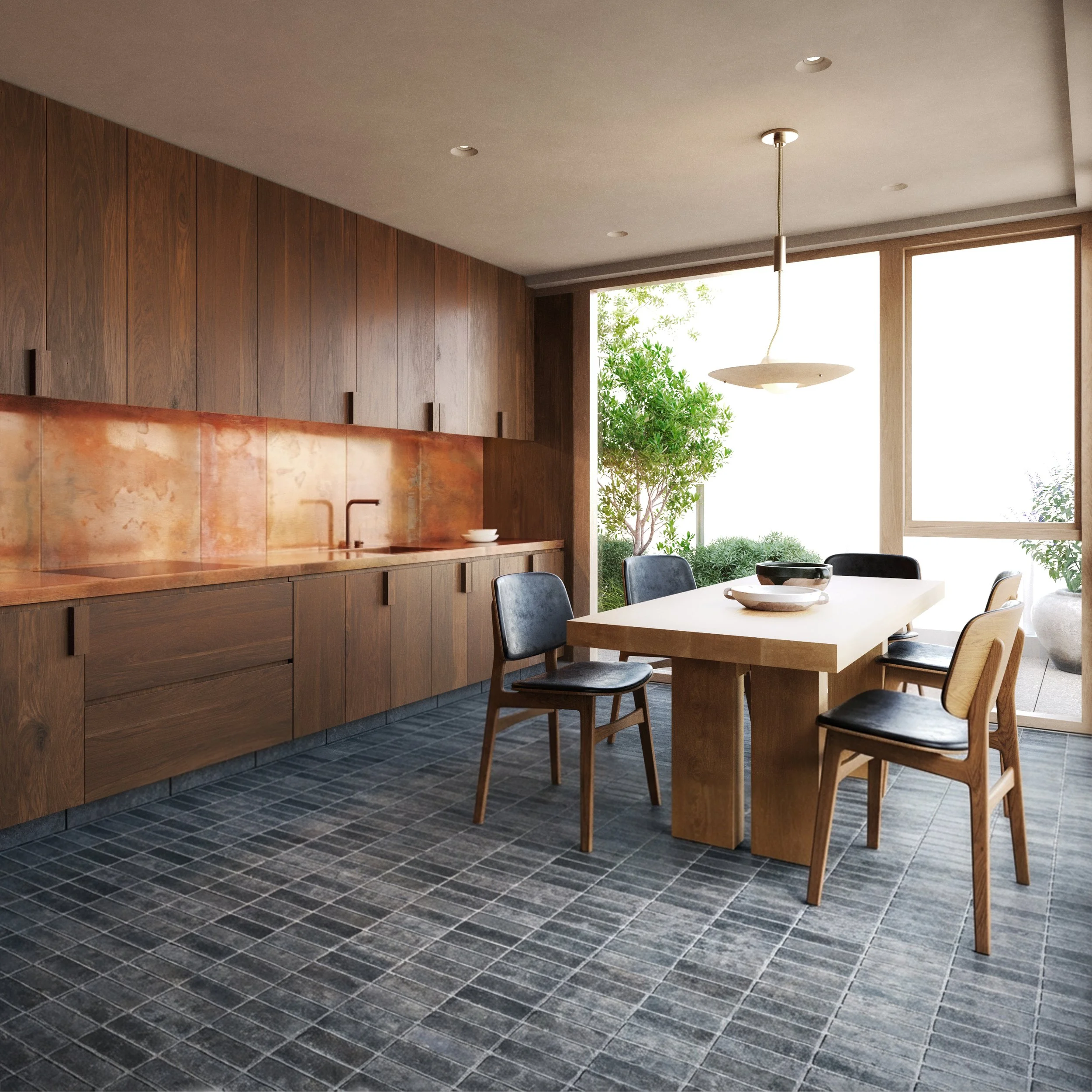 Modern kitchen with wooden cabinets, copper counter a wooden dining table, black and wooden chairs, large window with greenery outside, and a pendant light overhead.