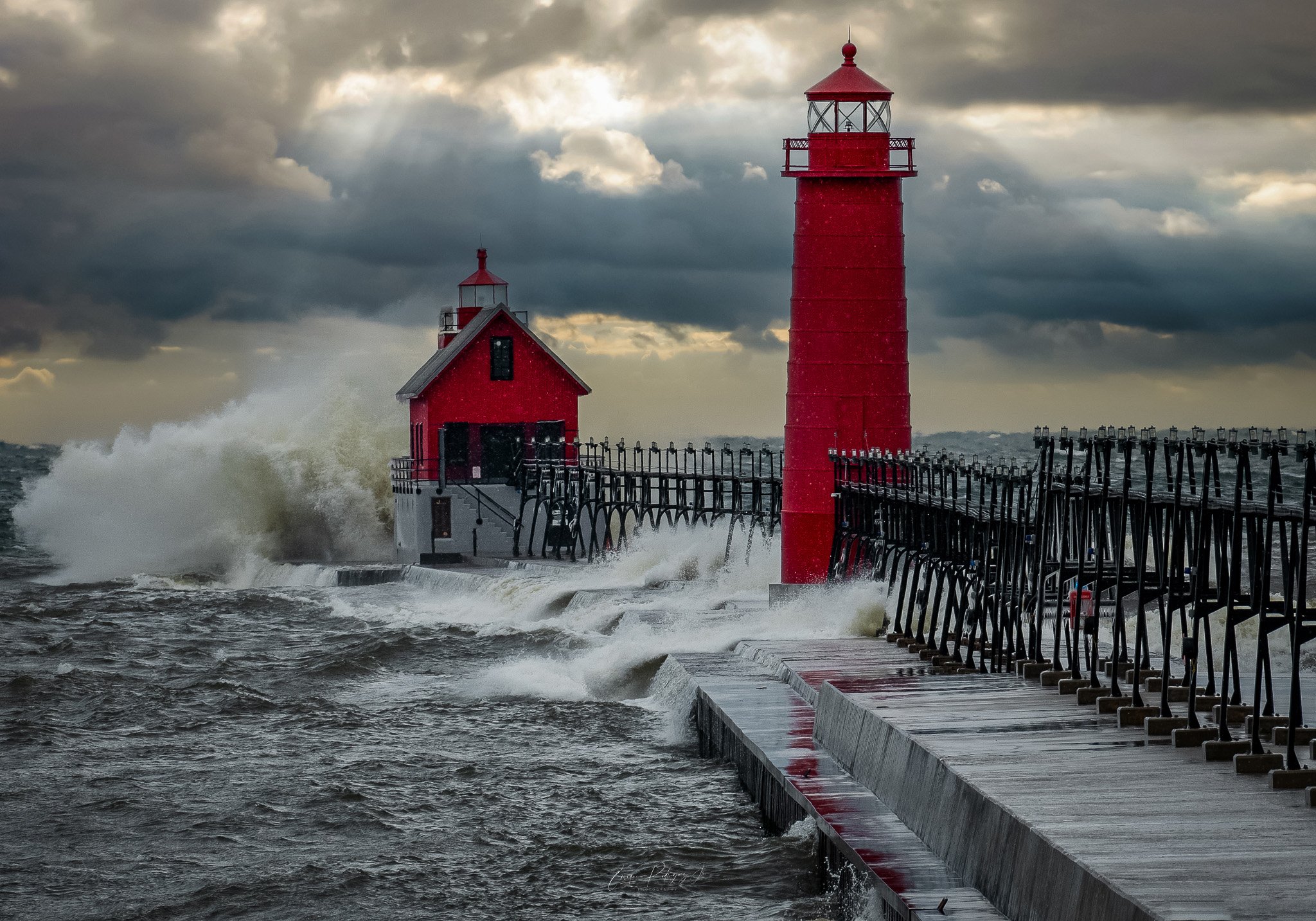 Grand Haven Lighthouse - Winter Snow Storm, Gal Force Winds Help Waves Crash Against The Pier