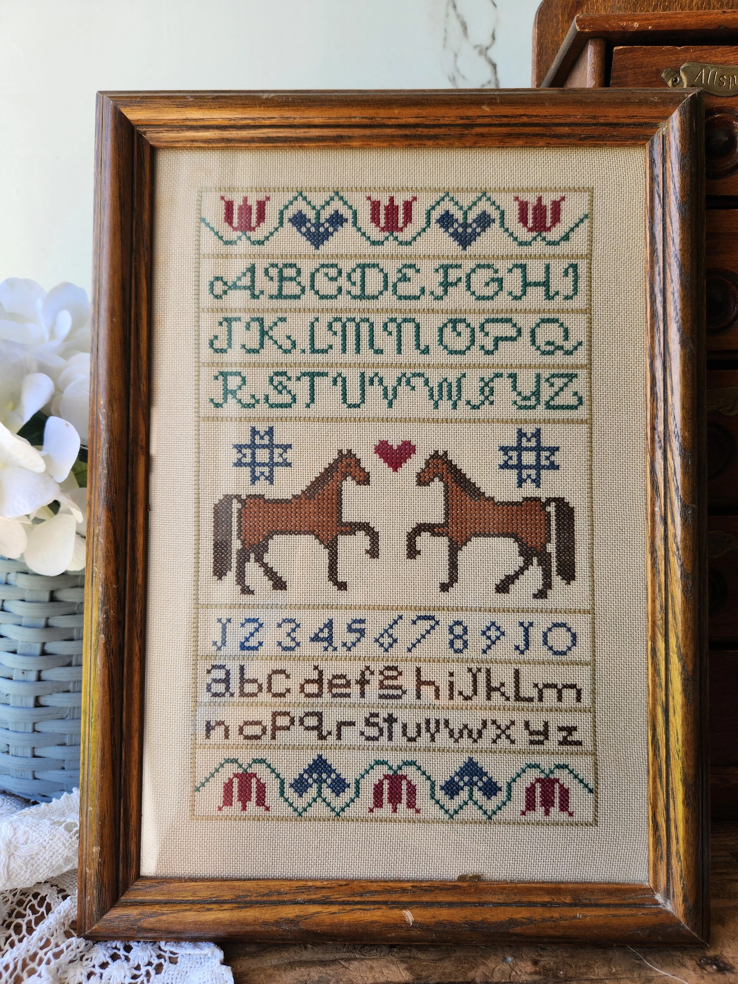 Vintage Crosstitch sampler framed in glass