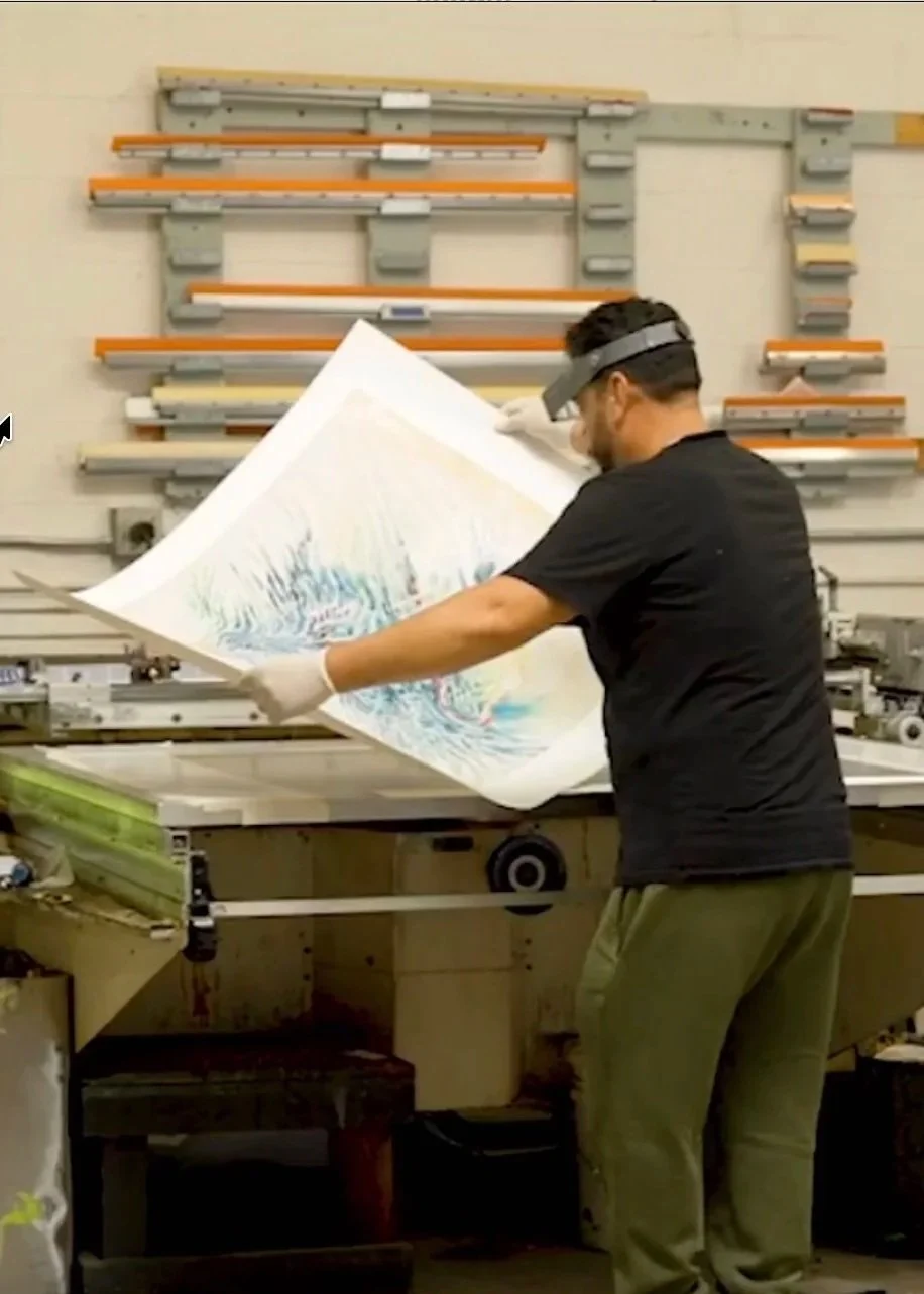 A Kolibri printer racking a freshly pulled sheet to dry between color passes.
