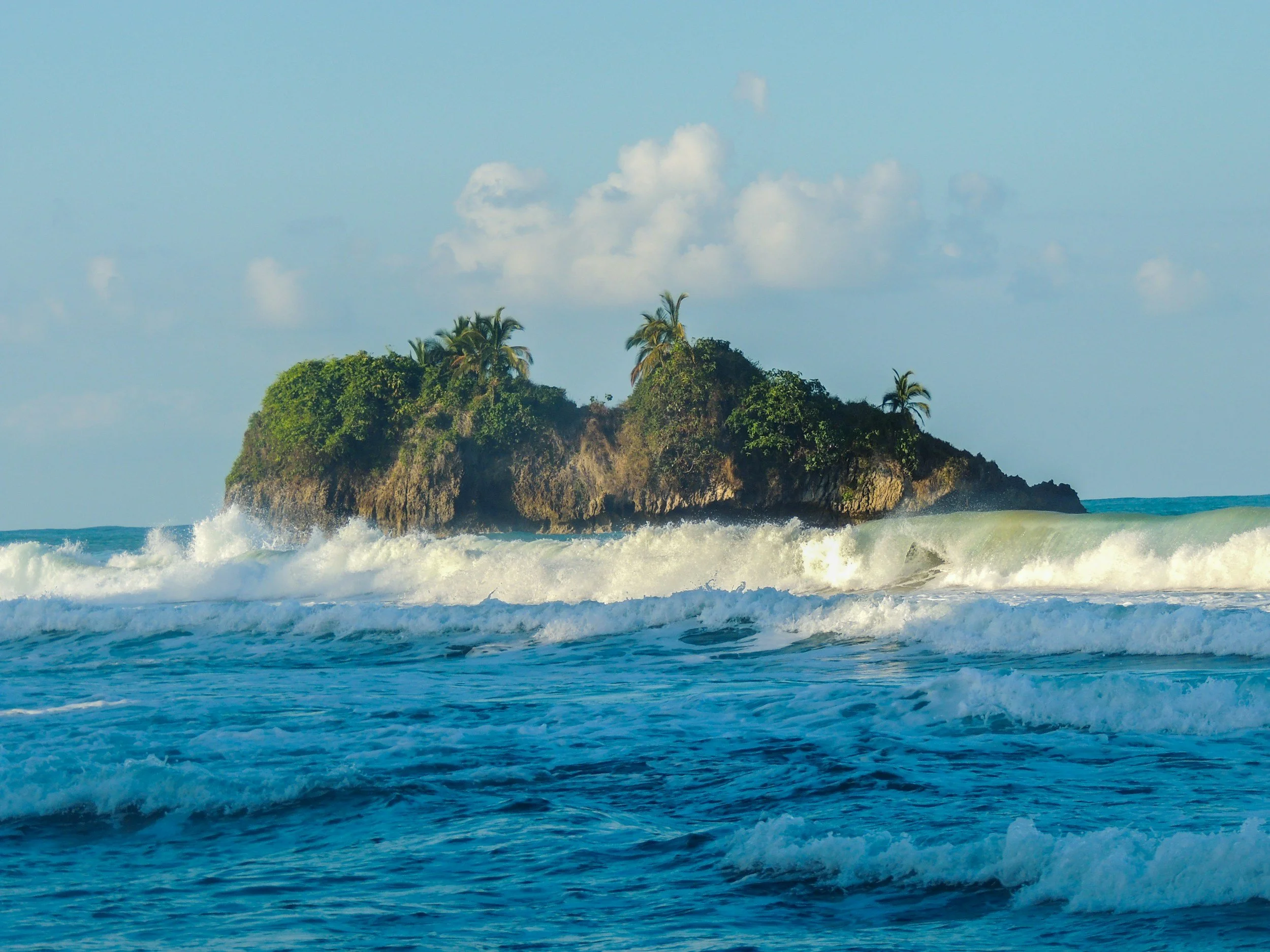 Cocles Beach wave break with Isla Cocles in the background