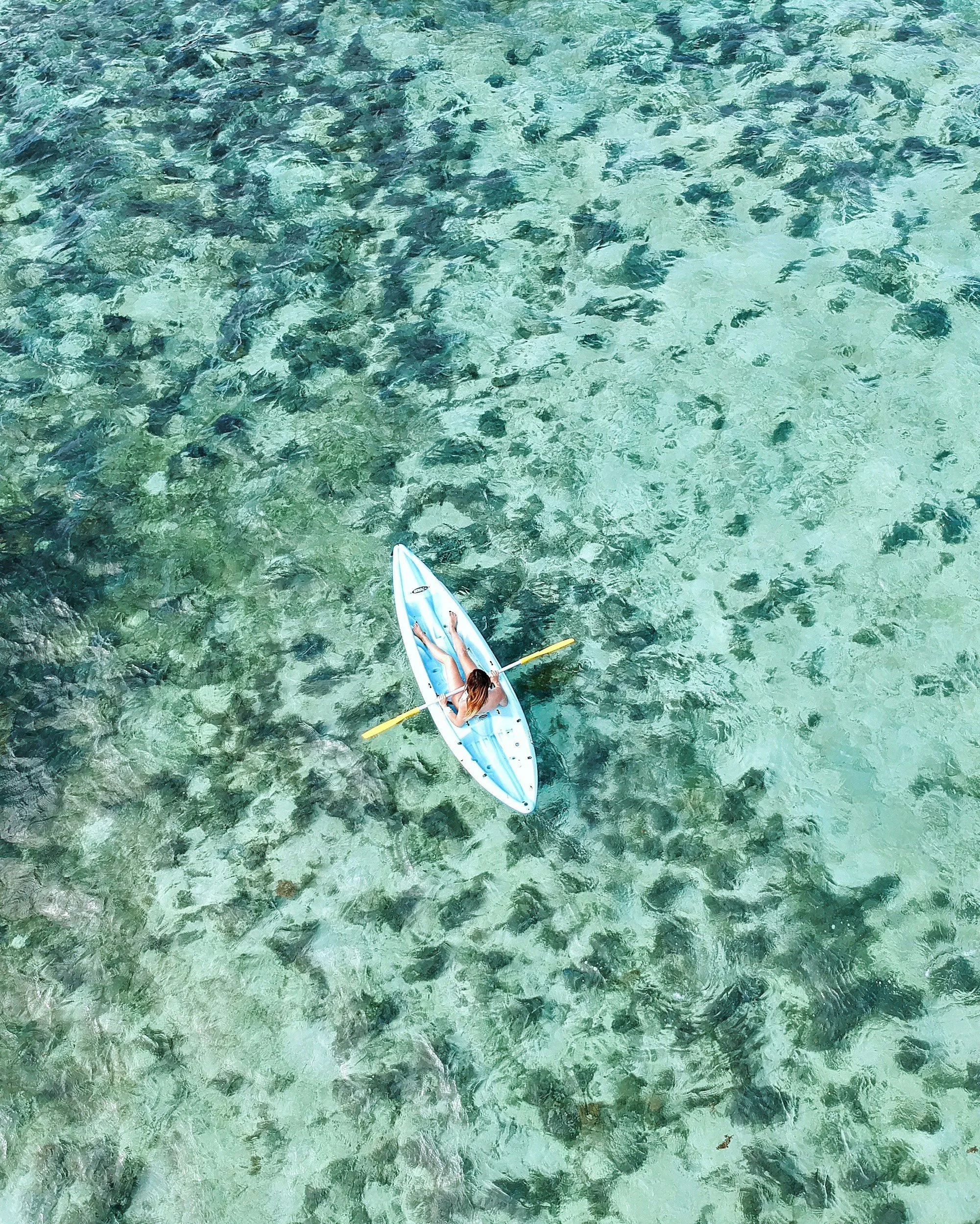 Kayaker enjoys the clear waters off Isla Chora