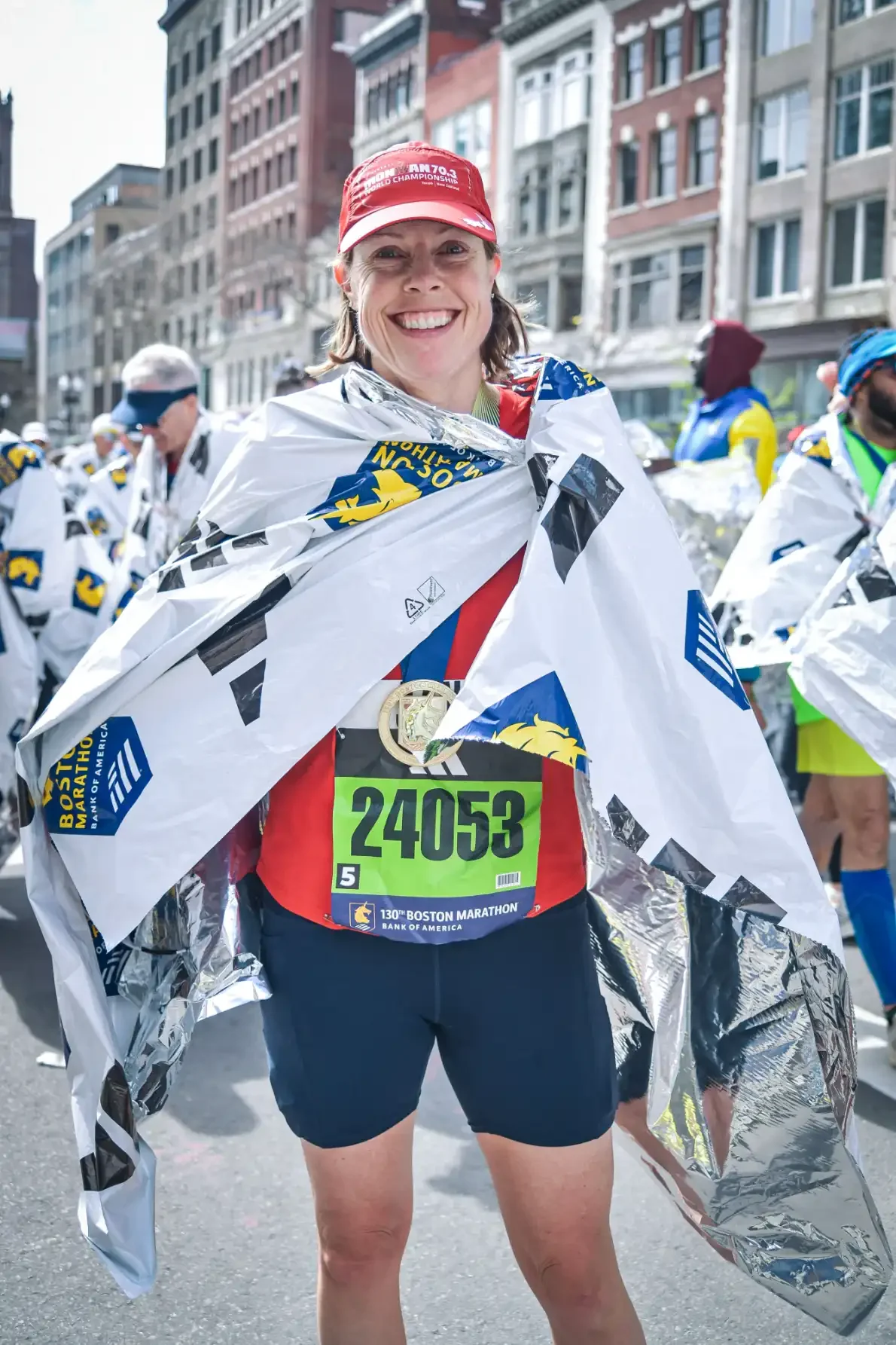 Jane Pilger at the finish line of the 2026 Boston Marathon with a mylar blanket