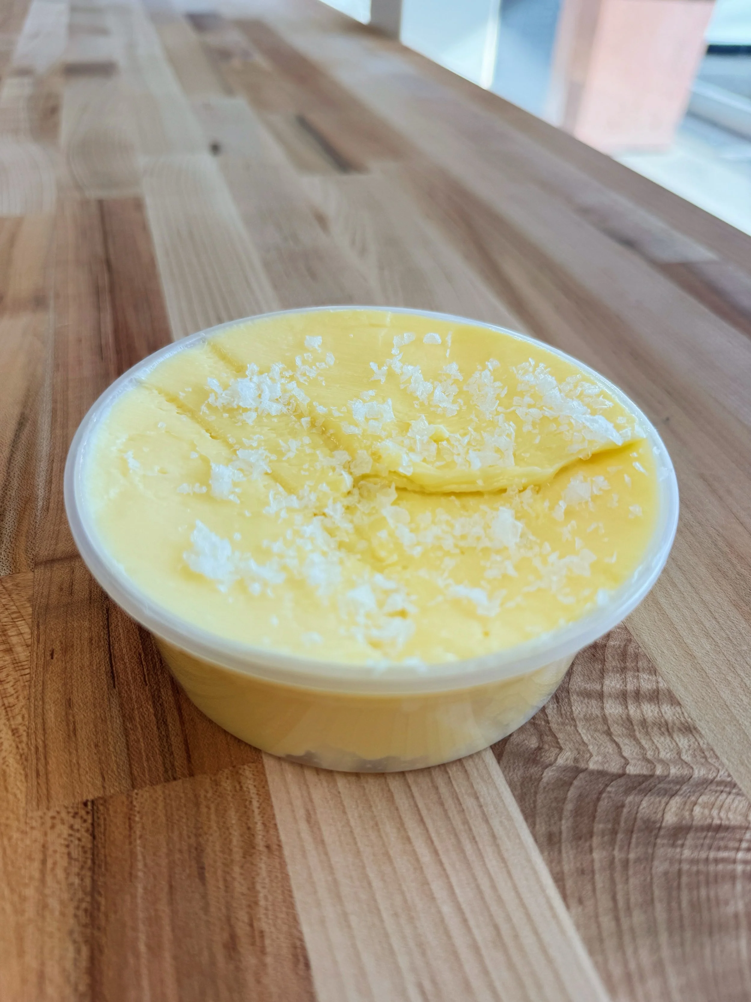 3-day Cultured Butter with Flaky Sea Salt 
Now available on our bakery side and online 
.
.
We culture our butter with organic heavy cream from @strausfamilycreamery. After 48 hours we churn it and hand-knead it. 
Funky, creamy, delicious. 
#bagels #
