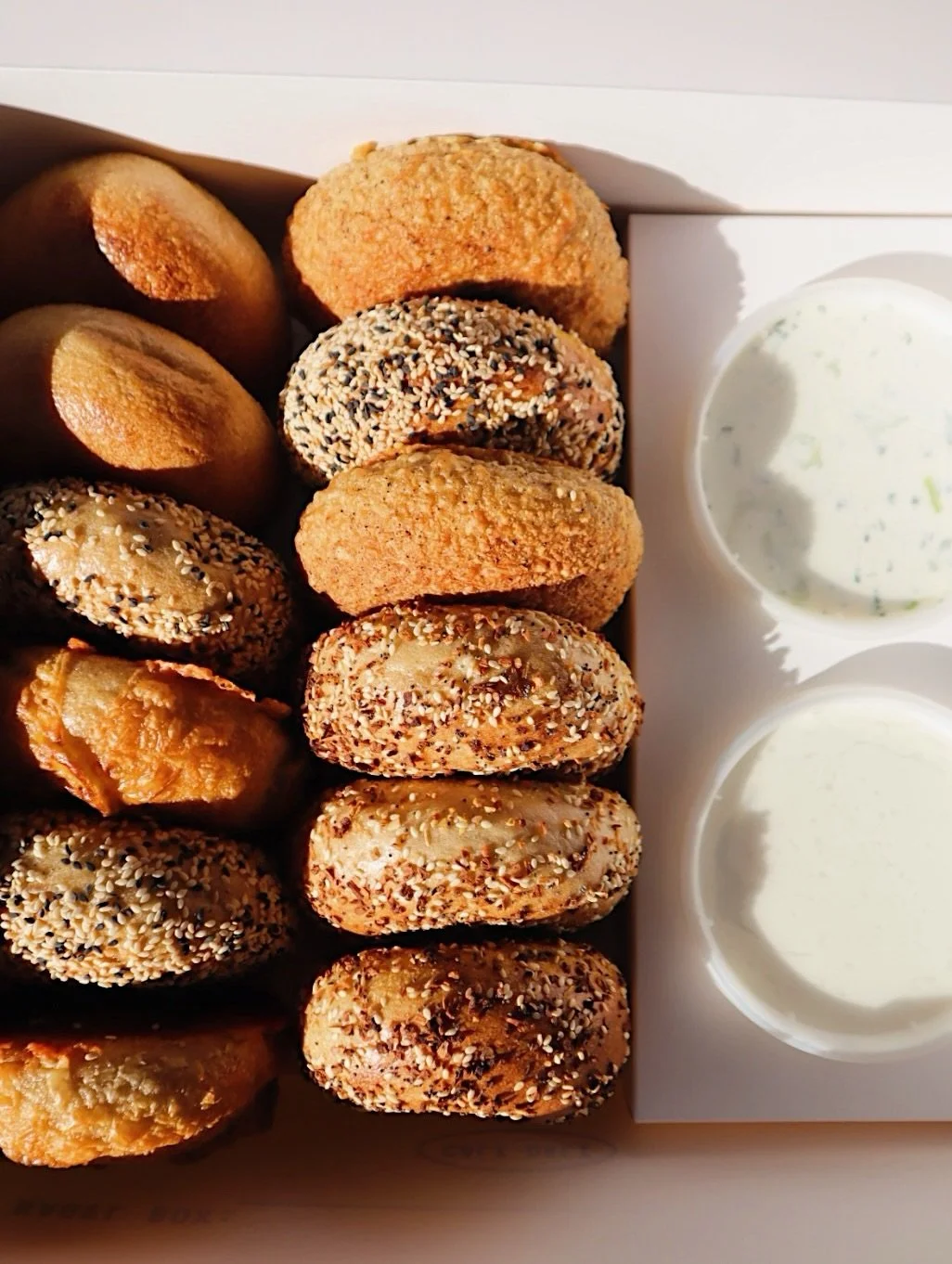 The Bagel Box | Serves 12 🥯🙌🏻
- 12 Bagels of choice ( Sliced or Whole) 
- Two 8 oz tubs of your Cream Cheese of Choice 
.
.
Availible when our next door expansion opens up! You can come in store and order one or order online and come pick one up! 