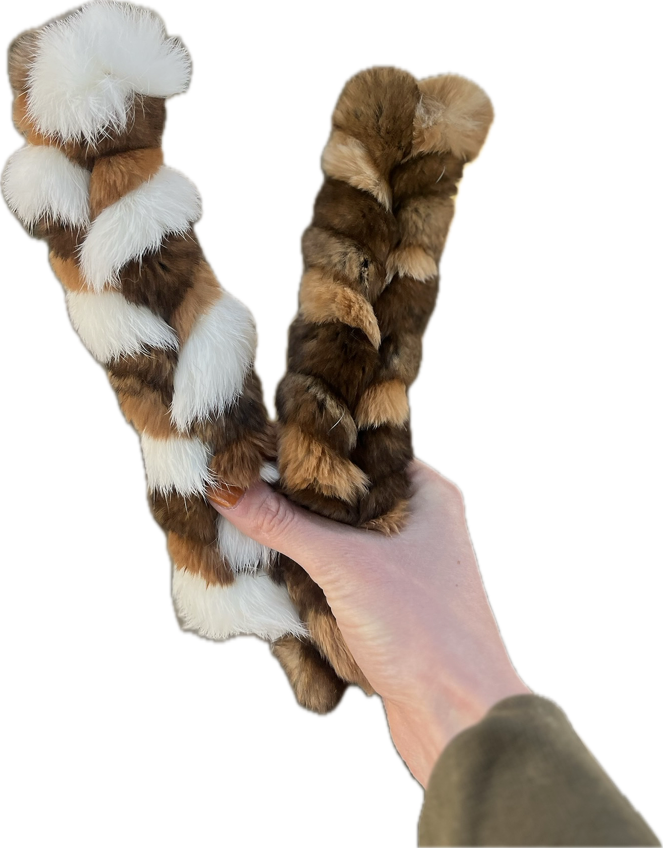 Hand holding two braided rabbit hide chews from H&N Homestead.