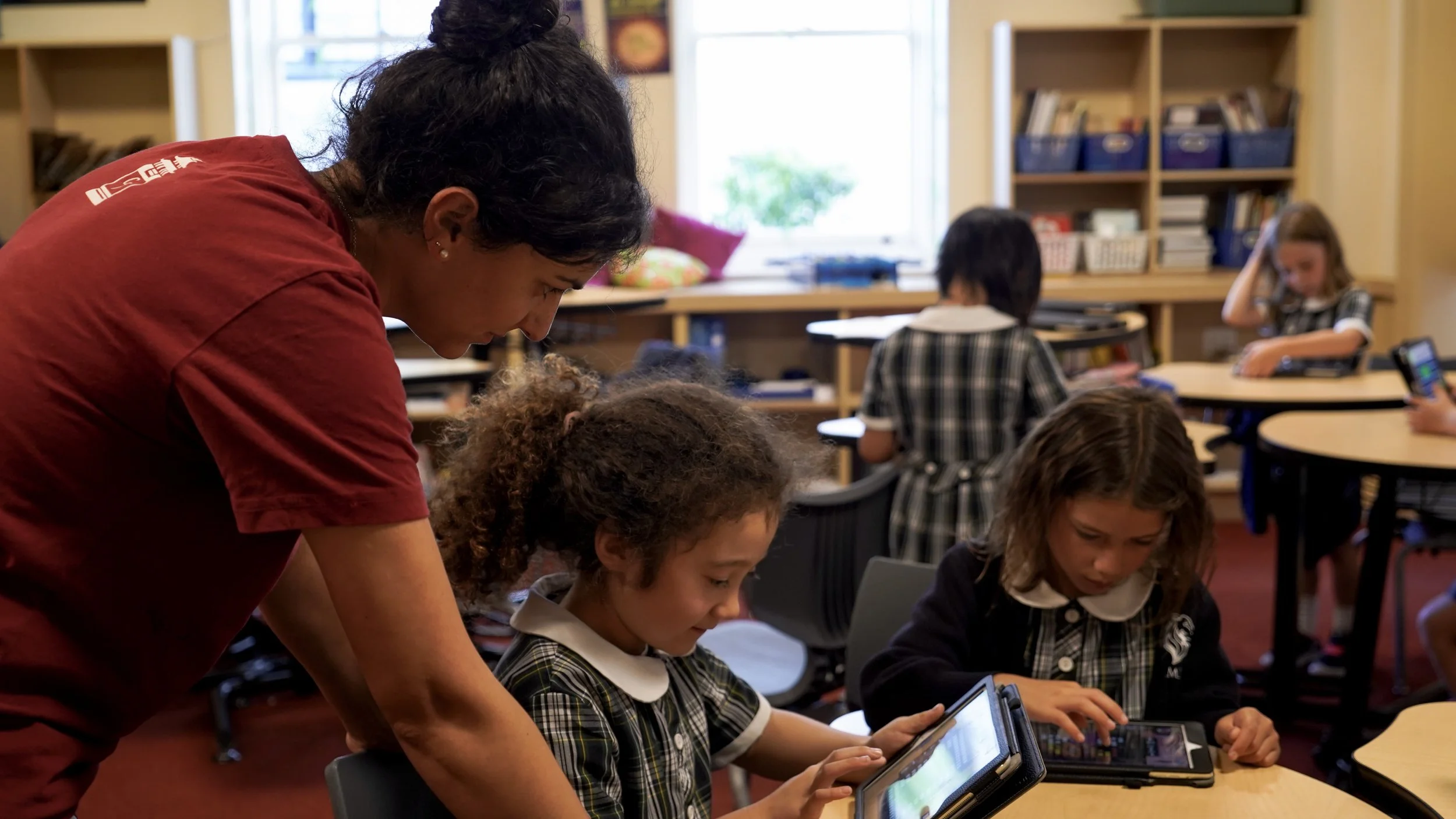 CodeFu instructor providing all equipment including tablets for after-school coding enrichment program