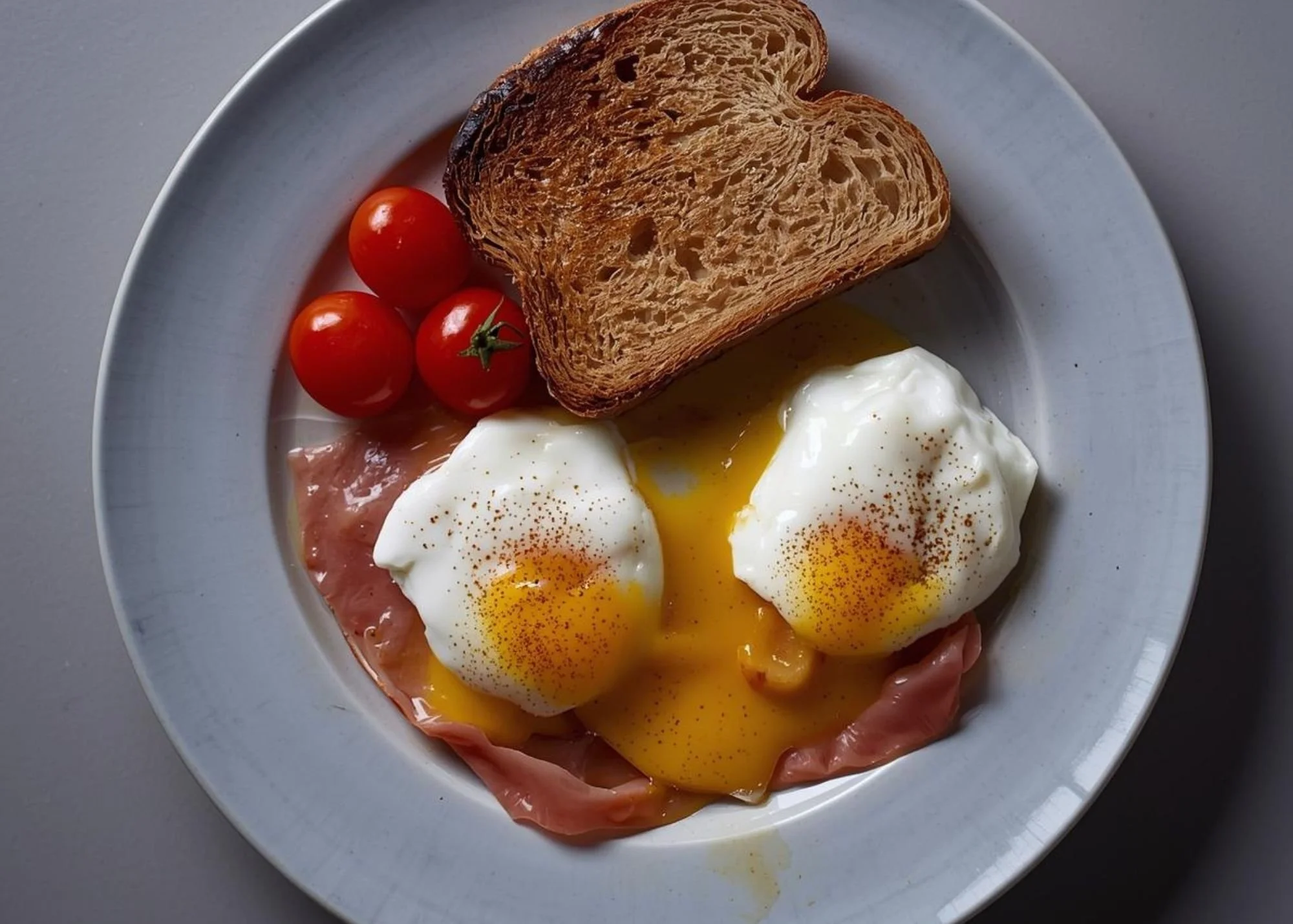 Simple high-protein breakfast for dinner with eggs, bacon, and veggies.